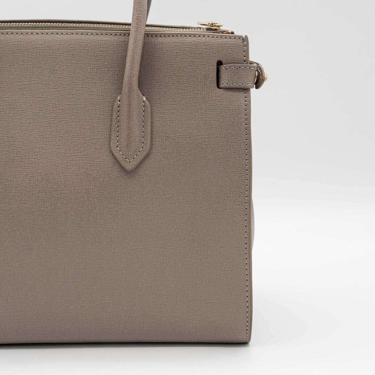 Furla grey Pin tote bag with top handles, gold hardware, and detachable strap against a white background.