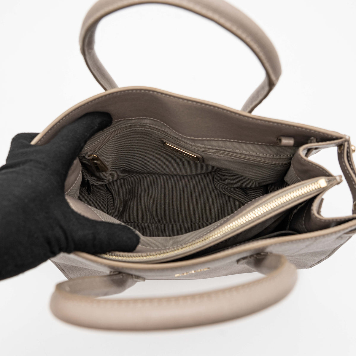 Furla grey Pin tote bag with top handles, gold hardware, and detachable strap against a white background.