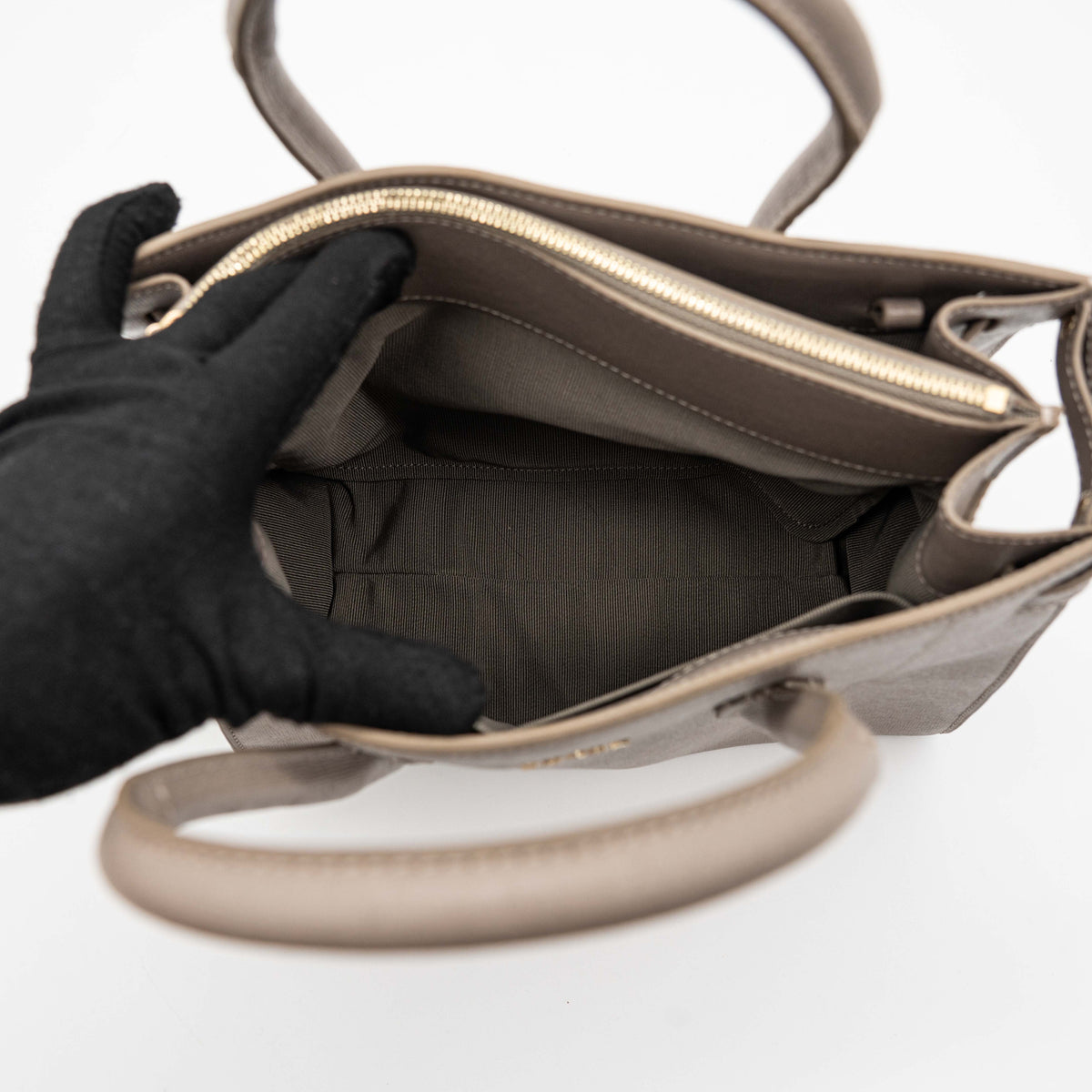 Furla grey Pin tote bag with top handles, gold hardware, and detachable strap against a white background.