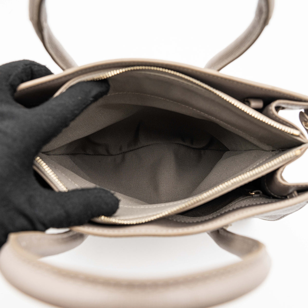 Furla grey Pin tote bag with top handles, gold hardware, and detachable strap against a white background.