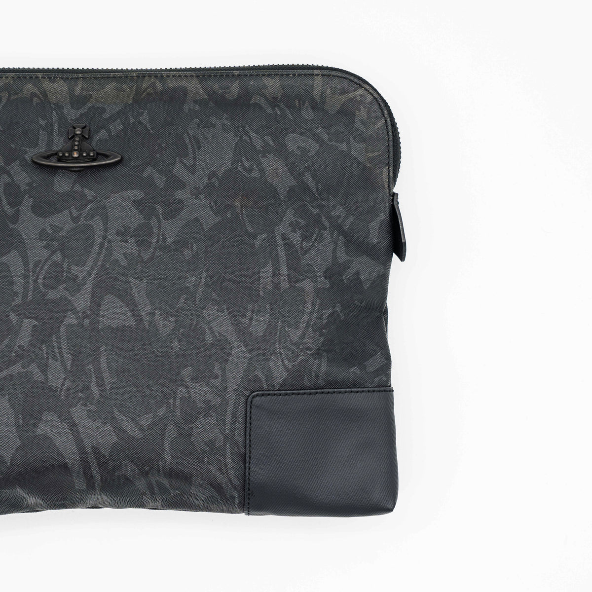Vivienne Westwood clutch bag in grey and black graphic camouflage with matte black Orb logo and leather trim, styled against a white background.