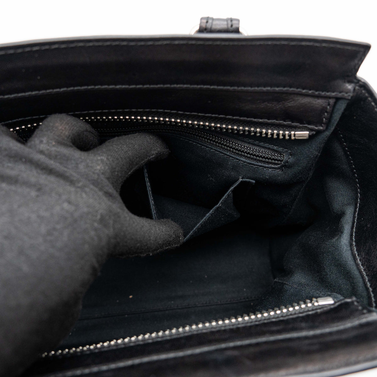 Coach Legacy Candace Carryall in black leather with double tassel charm and silver hardware, photographed against a white background.
