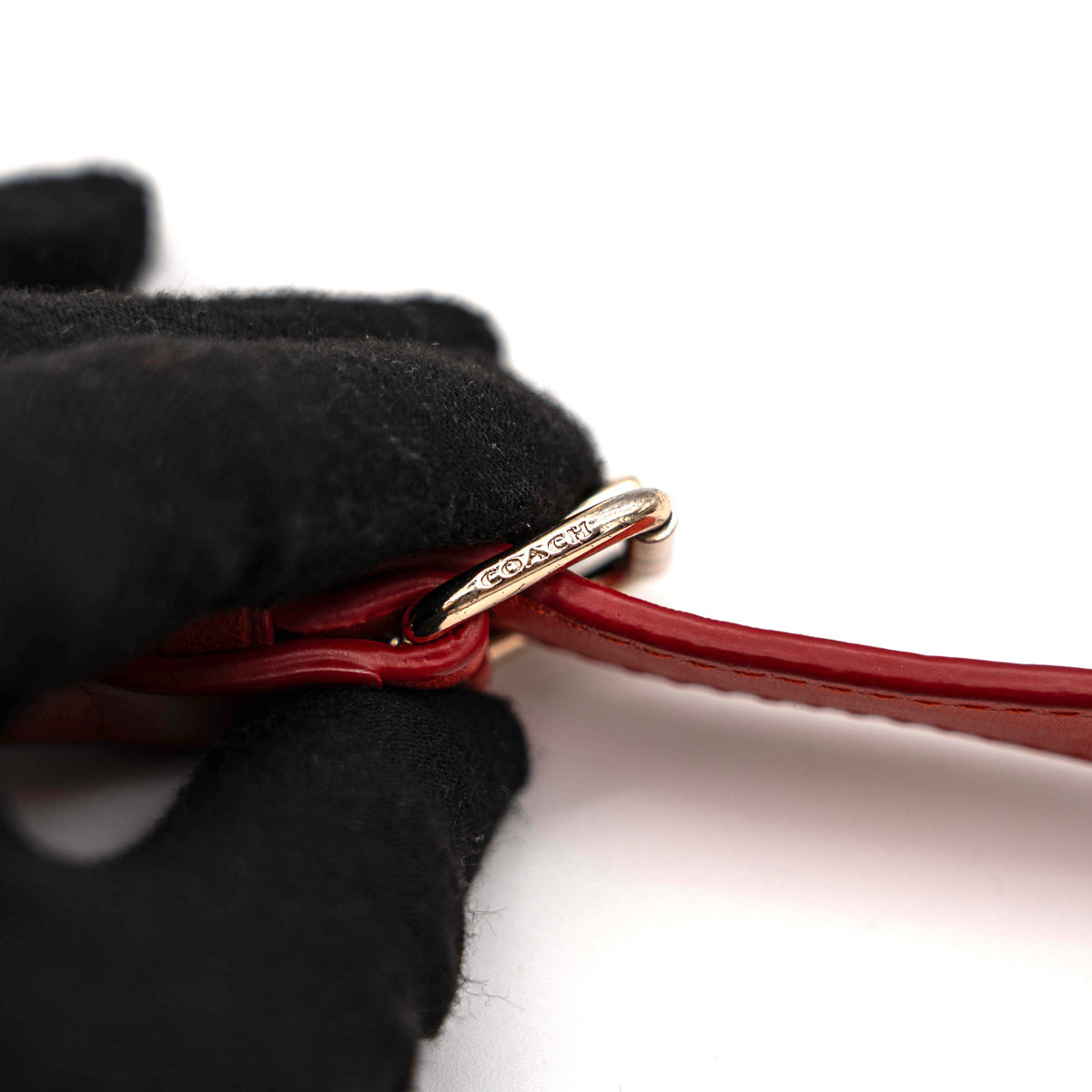 Coach Swagger 27 Carryall in textured red leather with gold hardware, shown with detachable shoulder strap.