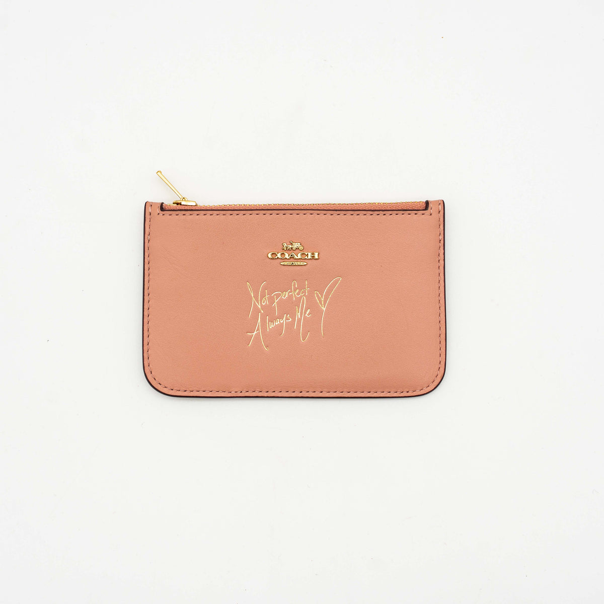 Coach x Selena Gomez colorblock zip card case in pink, burgundy, and black leather with gold hardware and script detail.