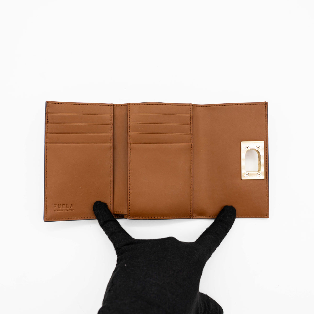 Furla 1927 M Compact Wallet in brown and black leather with gold hardware, photographed front facing on a white background.