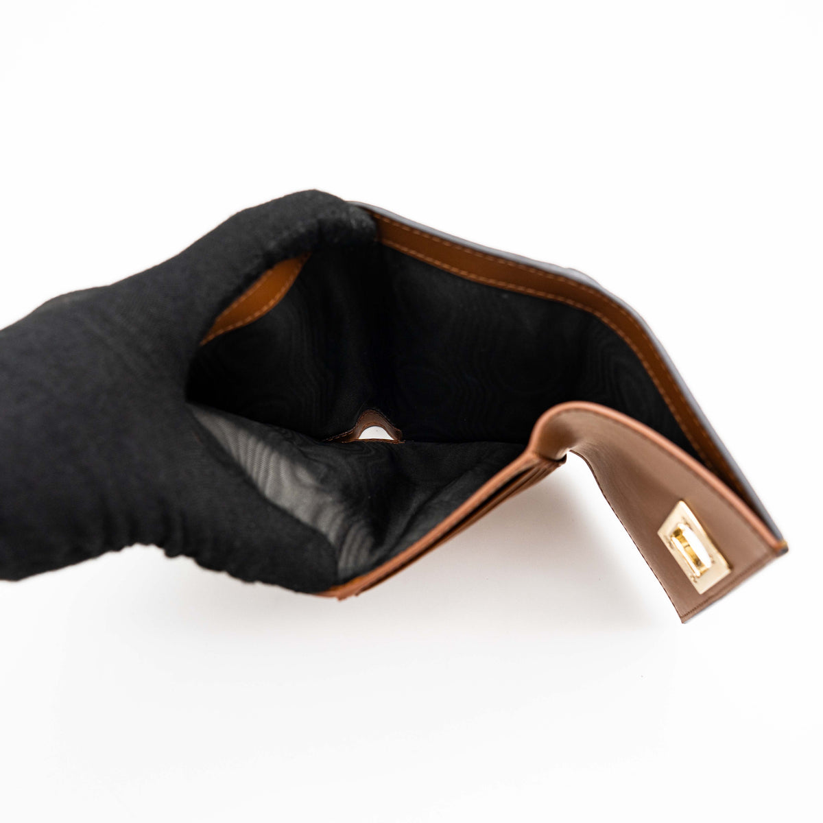 Furla 1927 M Compact Wallet in brown and black leather with gold hardware, photographed front facing on a white background.