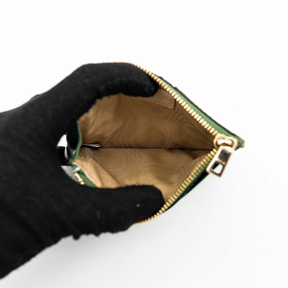 Furla Camelia S zipped card case in green leather with gold hardware and multiple card slots.