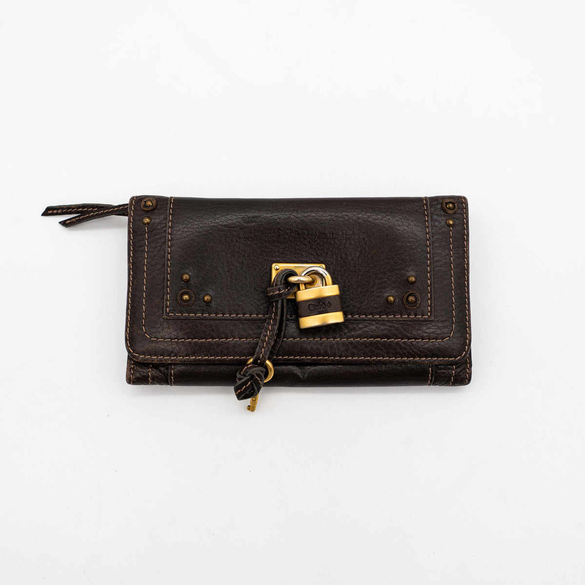 Chloé Paddington long wallet in dark brown leather with signature gold-tone padlock on the front.