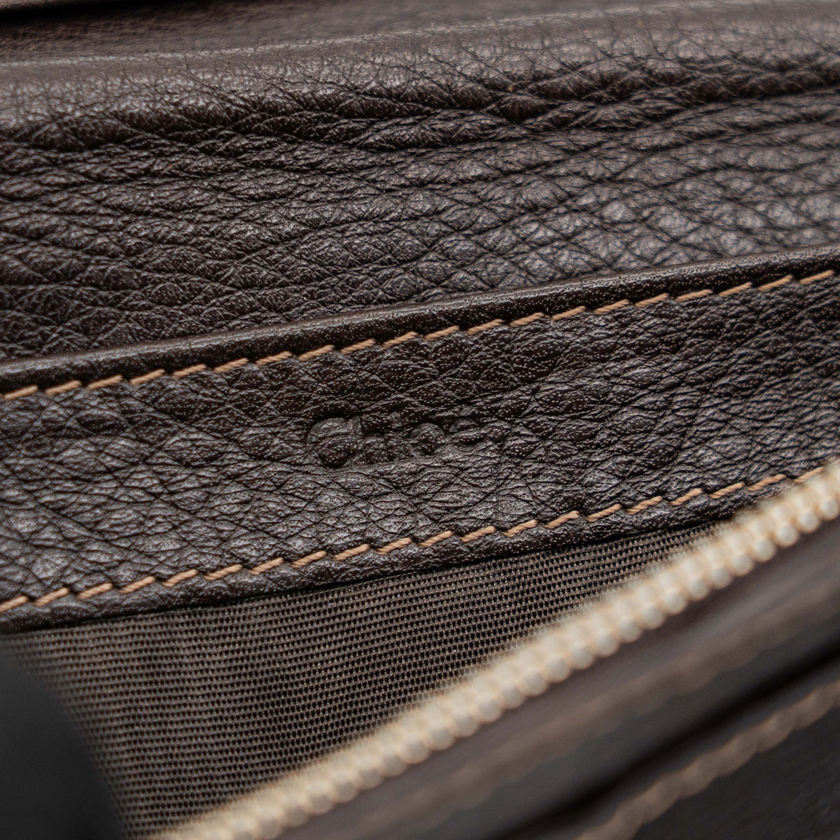 Chloé Paddington long wallet in dark brown leather with signature gold-tone padlock on the front.