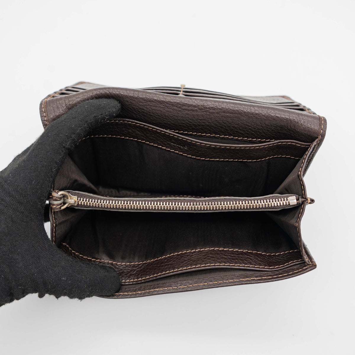 Chloé Paddington long wallet in dark brown leather with signature gold-tone padlock on the front.