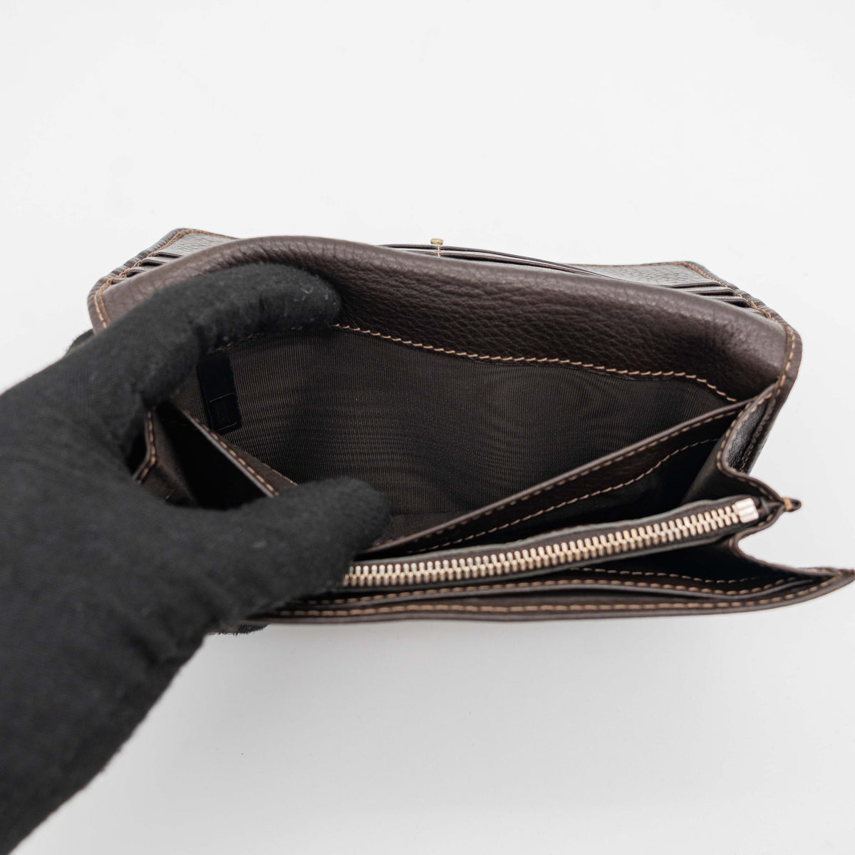 Chloé Paddington long wallet in dark brown leather with signature gold-tone padlock on the front.