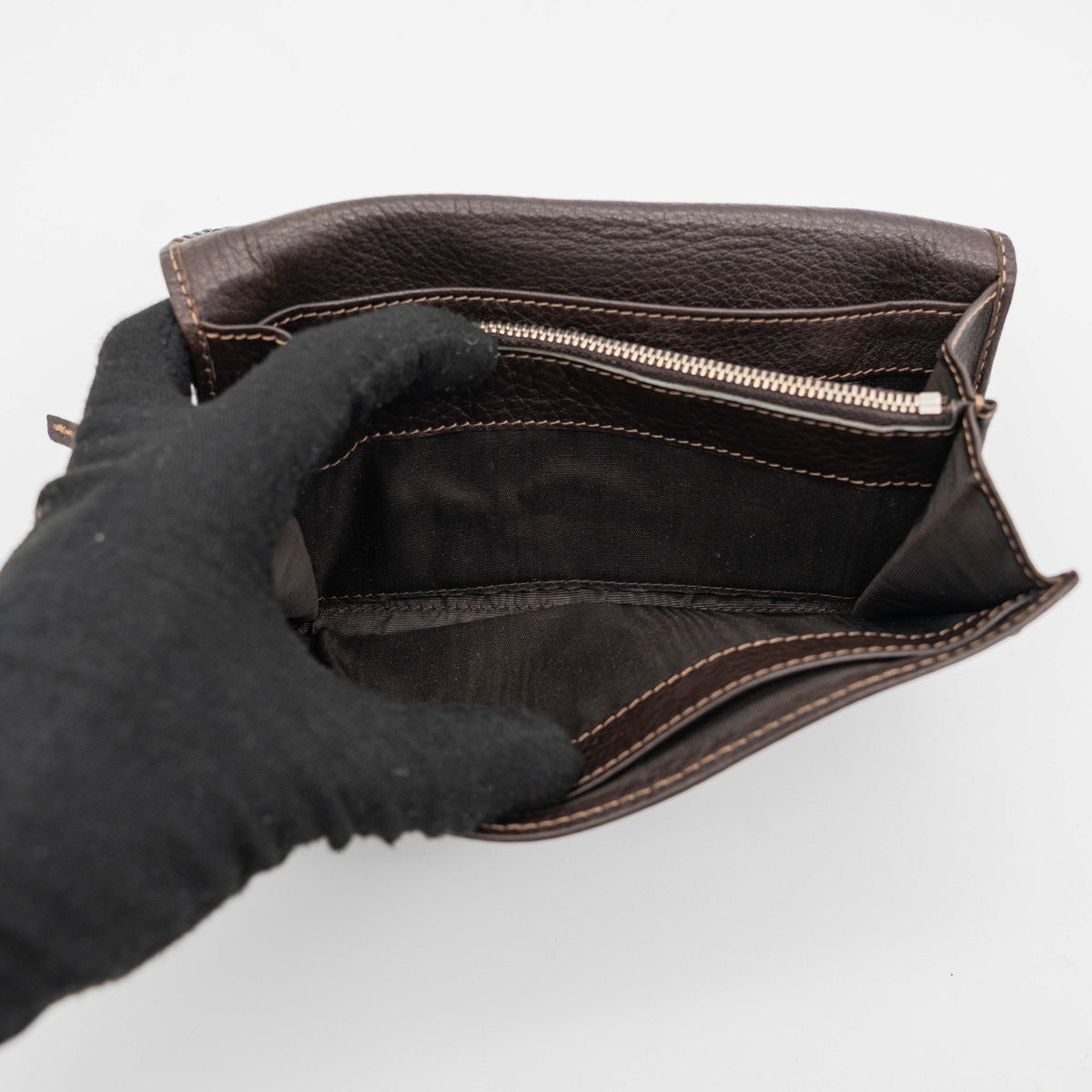 Chloé Paddington long wallet in dark brown leather with signature gold-tone padlock on the front.