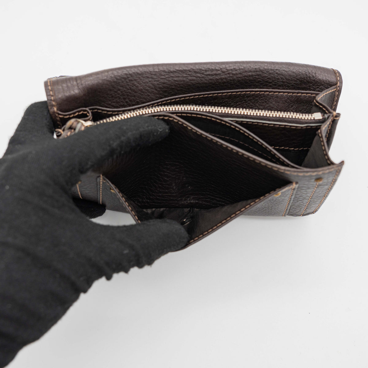 Chloé Paddington long wallet in dark brown leather with signature gold-tone padlock on the front.