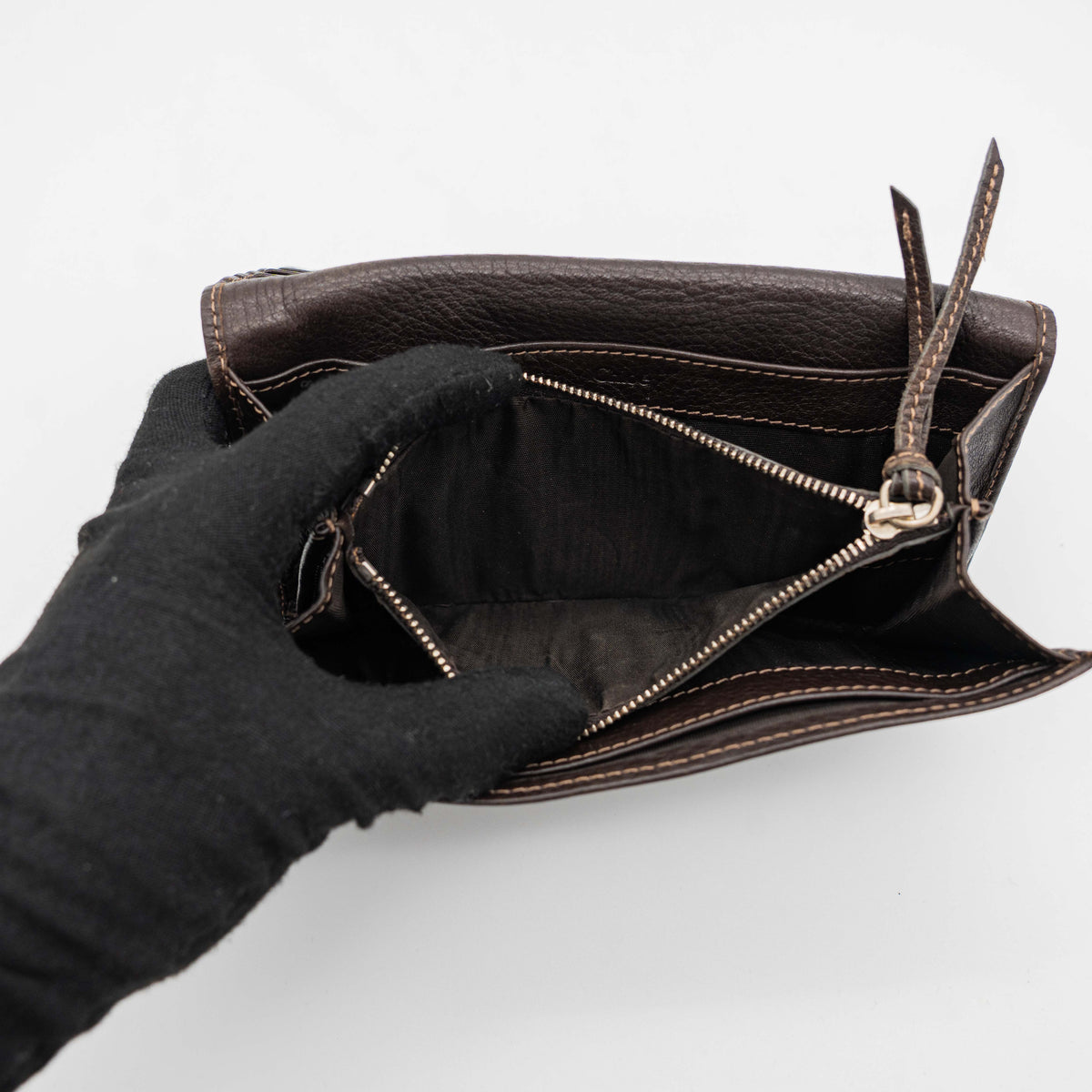 Chloé Paddington long wallet in dark brown leather with signature gold-tone padlock on the front.