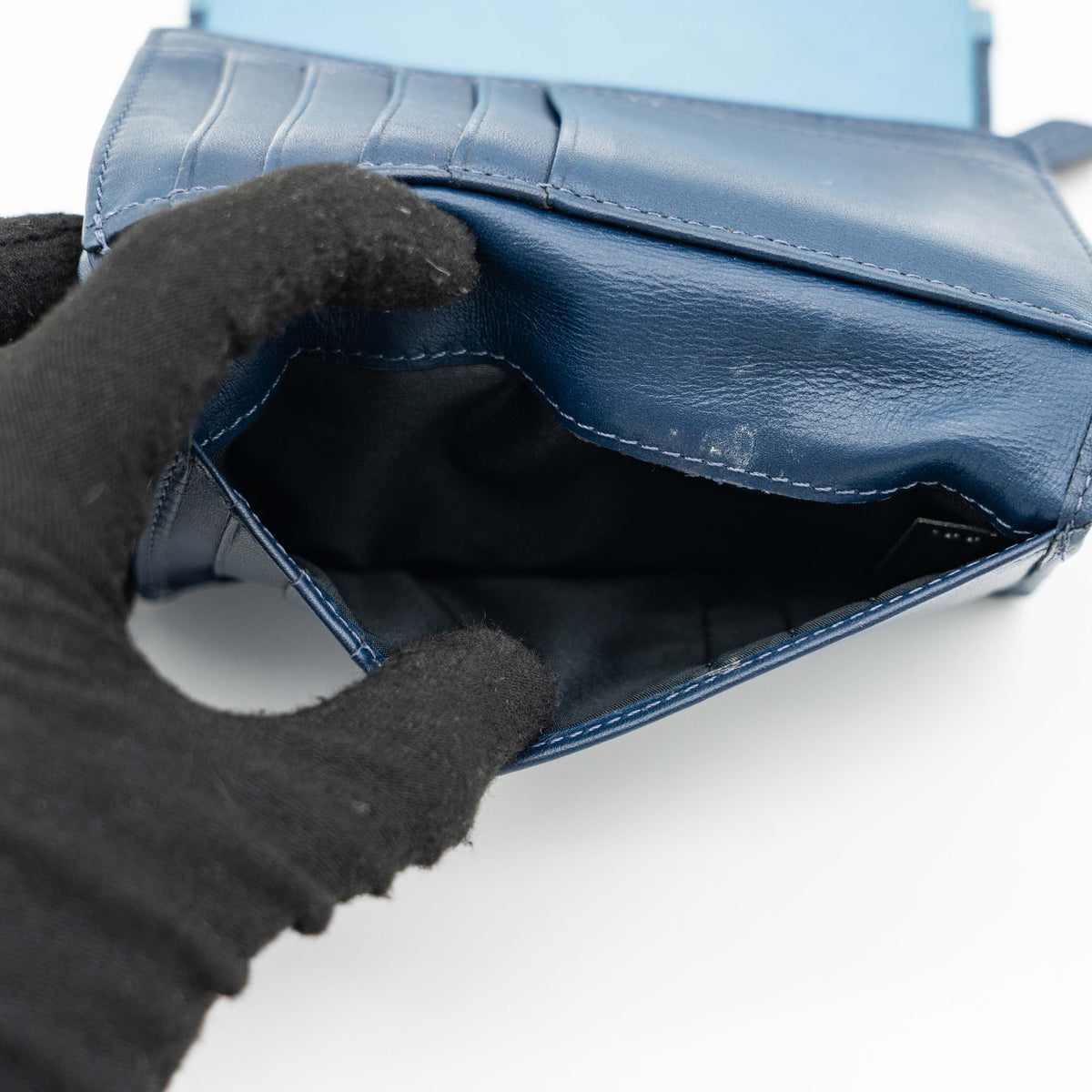 Coach Signature Ashley compact wallet in blue jacquard with leather trim, featuring a silver logo and organized interior.