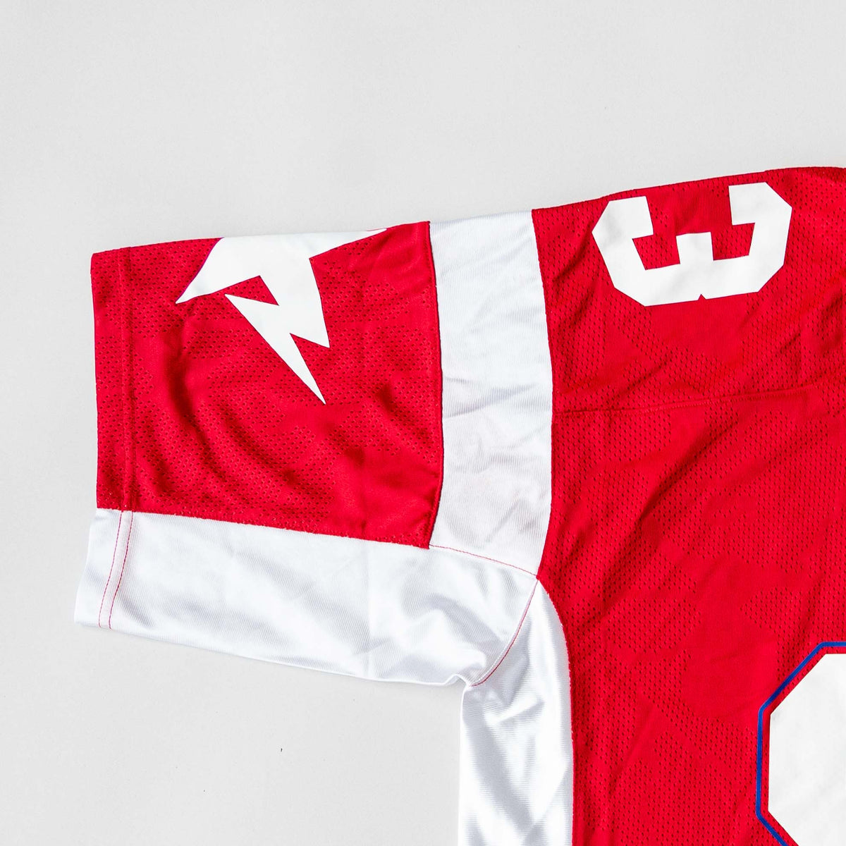 Front view of BAPE Solid Camo Jacquard Mesh Cropped Fit Football Jersey in red and white with bold '93' print and original tags.