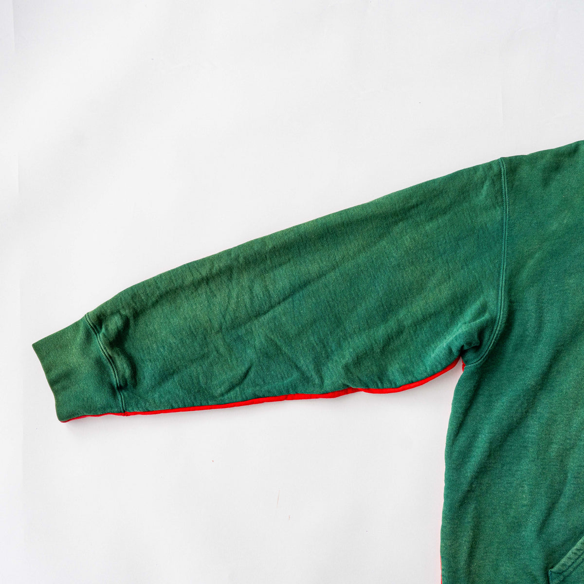 Supreme S Logo Split Hooded Sweatshirt in dark green and red, featuring front 'S' patch and a bold colour contrast.