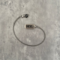 Diesel Signature 'For Successful Living' Dog Tag Necklace in stainless steel, featuring a brushed metal pendant and fine box chain.