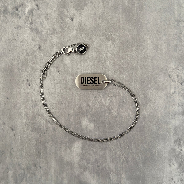 Diesel Signature 'For Successful Living' Dog Tag Necklace in stainless steel, featuring a brushed metal pendant and fine box chain.