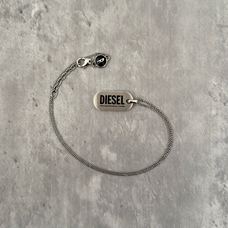 Diesel Signature 'For Successful Living' Dog Tag Necklace in stainless steel, featuring a brushed metal pendant and fine box chain.