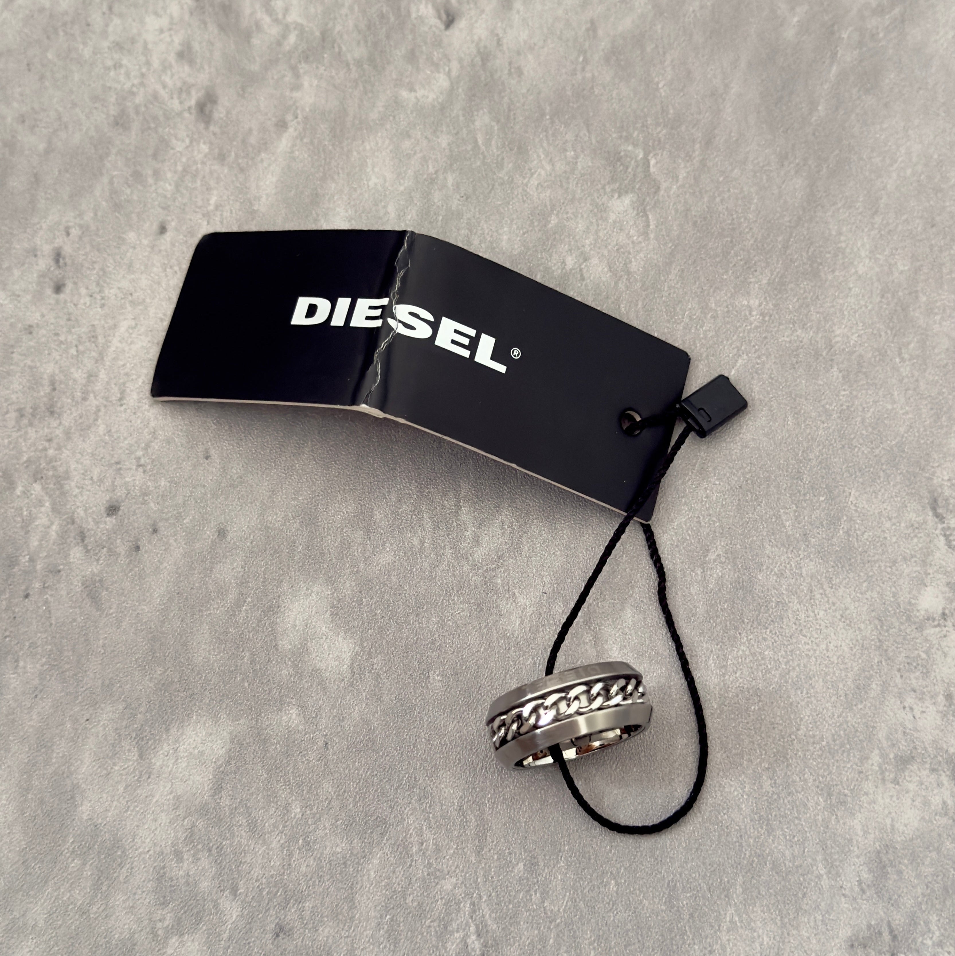 Diesel Stainless Steel Chain Inlay Ring with engraved Diesel logo and a bold chain-link detail.