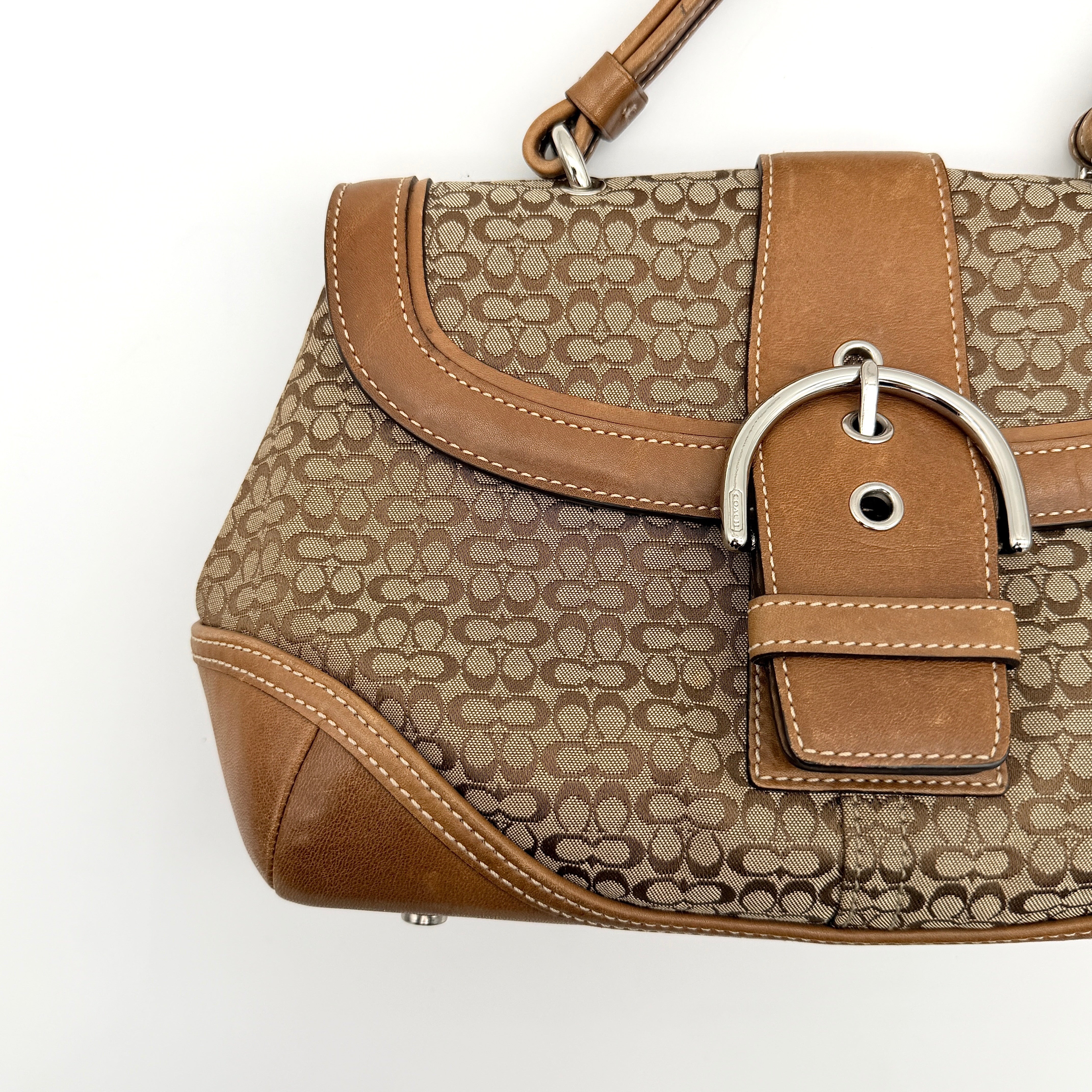 Coach Signature Soho Shoulder Bag in beige and tan monogram canvas with tan leather trim, shown on white background.