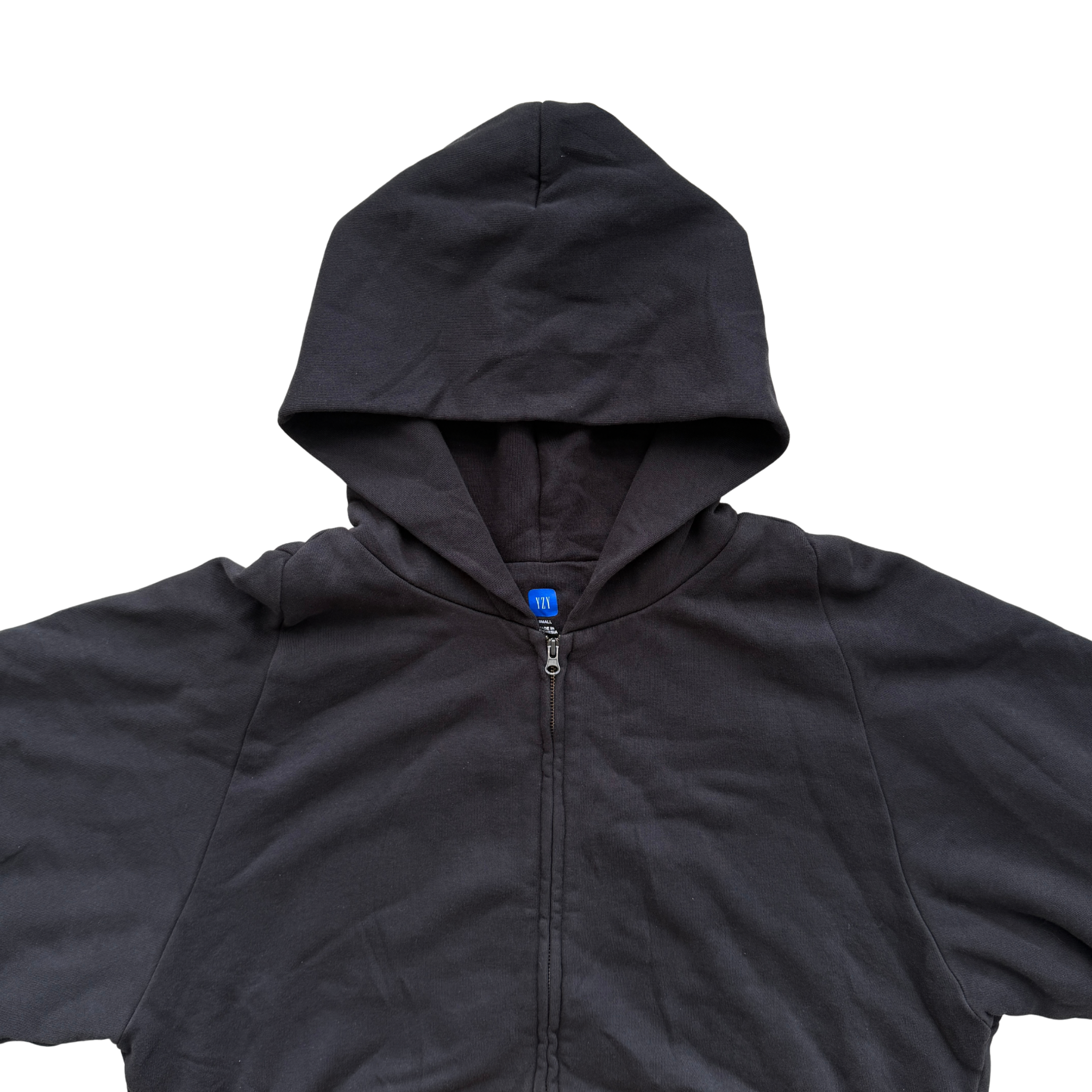 Yeezy x Gap black zip up hoodie with hood, displayed flat to show front and pocket details.