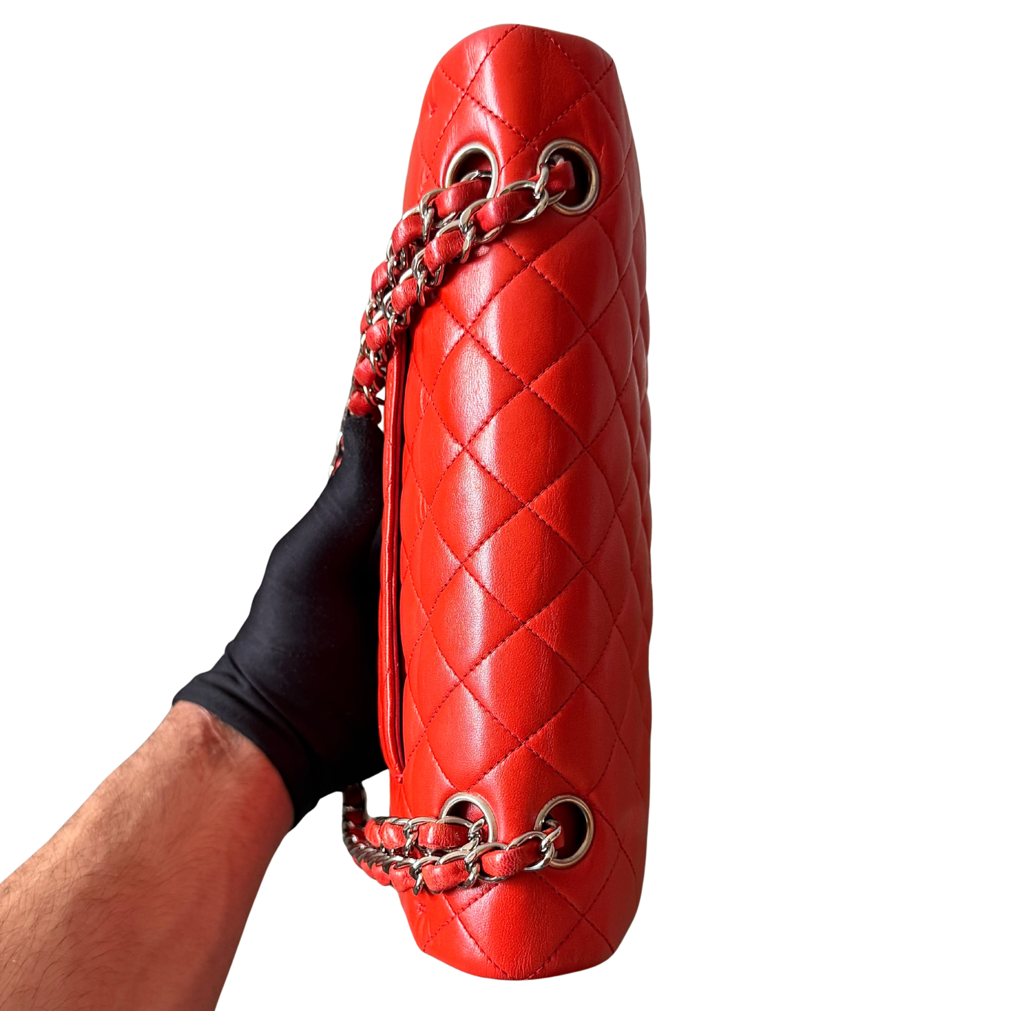 Chanel double flap shoulder bag in quilted red leather with silver-tone hardware and chain leather strap.