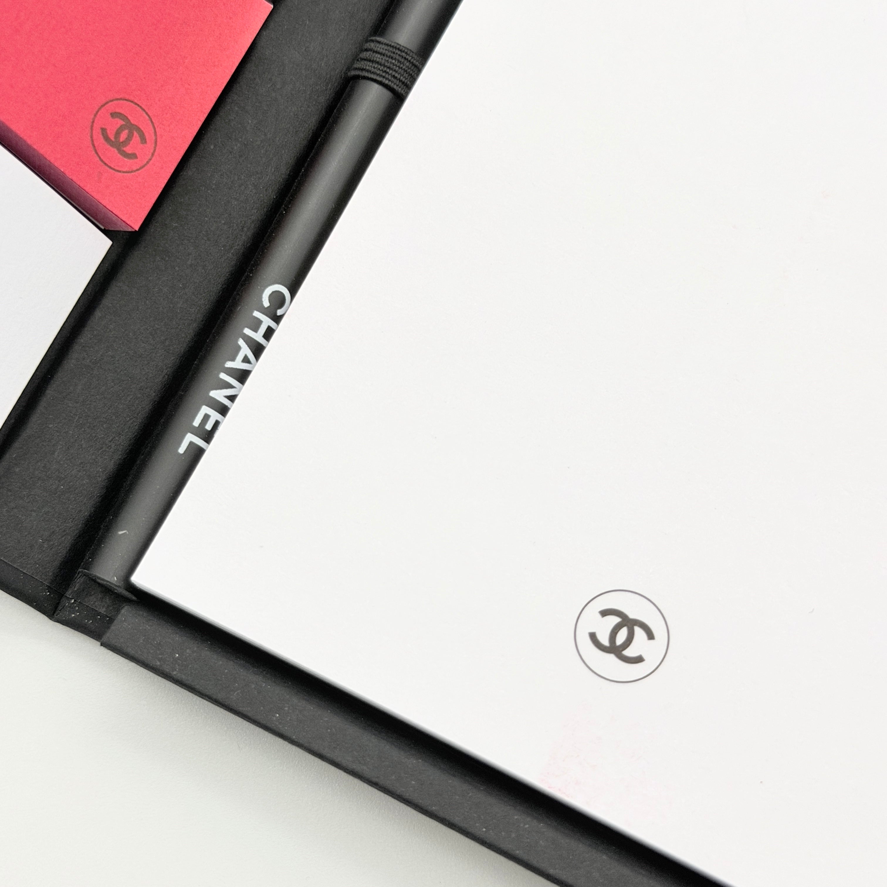 Chanel La Collection Novelty Book Stationary Set with black folder and branded box displayed on a white background