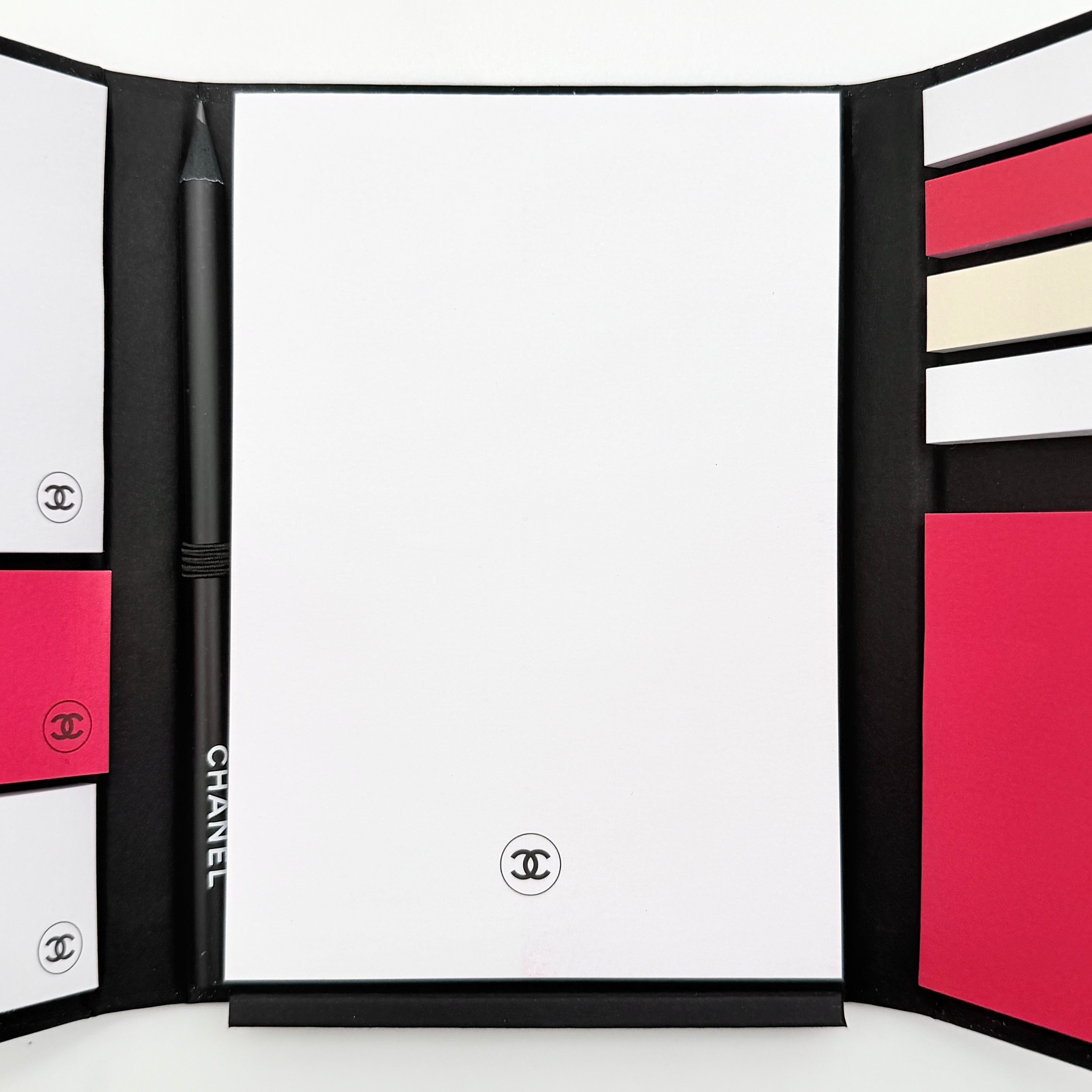 Chanel La Collection Novelty Book Stationary Set with black folder and branded box displayed on a white background