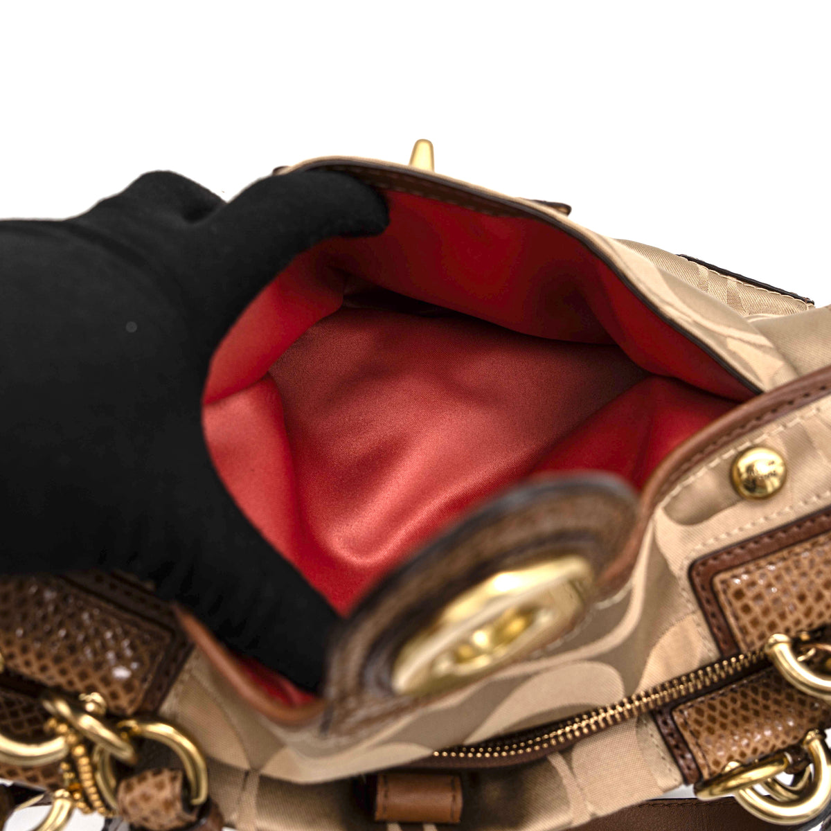 Coach Signature Peyton Shoulder Bag in brown sateen and leather with gold-tone hardware and turnlock pocket, photographed on a white background.