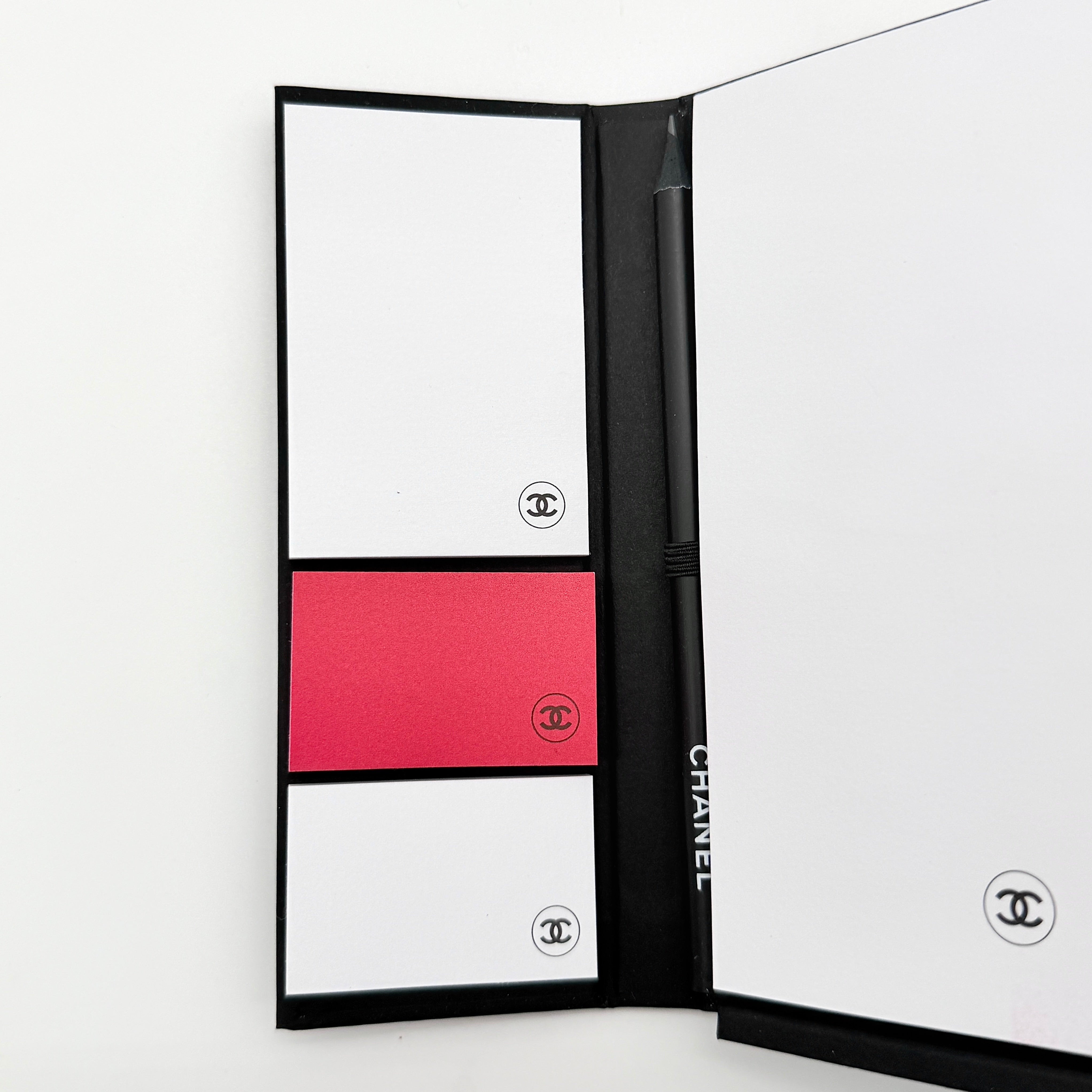 Chanel La Collection Novelty Book Stationary Set with black folder and branded box displayed on a white background