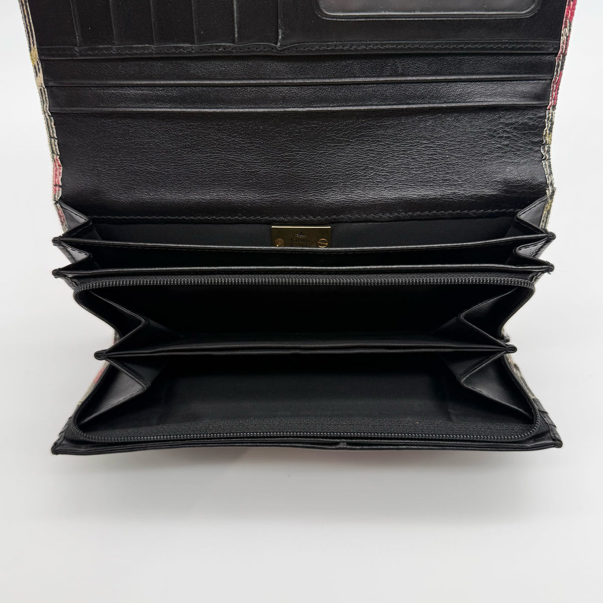 Vivienne Westwood multicolour tartan check long wallet with gold orb logo, shown closed against a white background.