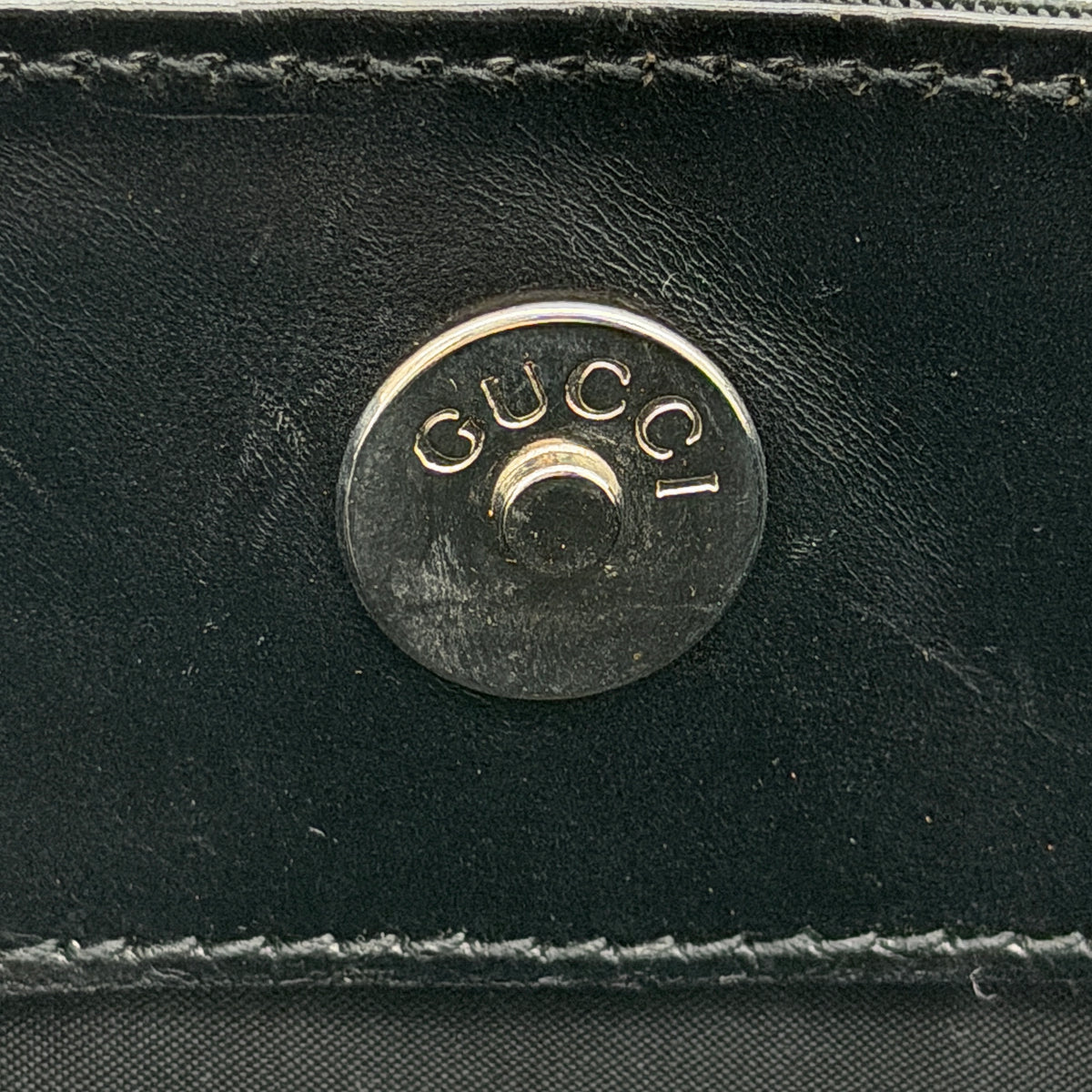 Gucci black nylon shoulder bag with bamboo handle and detachable strap shown with dust bag.