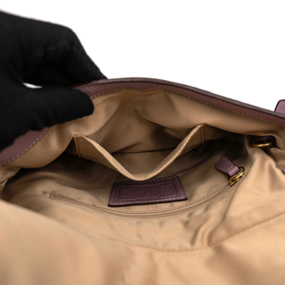 Coach Hamptons Turnlock Shoulder Bag in lilac purple leather with gold-tone hardware and contrast stitching, shown from the front.