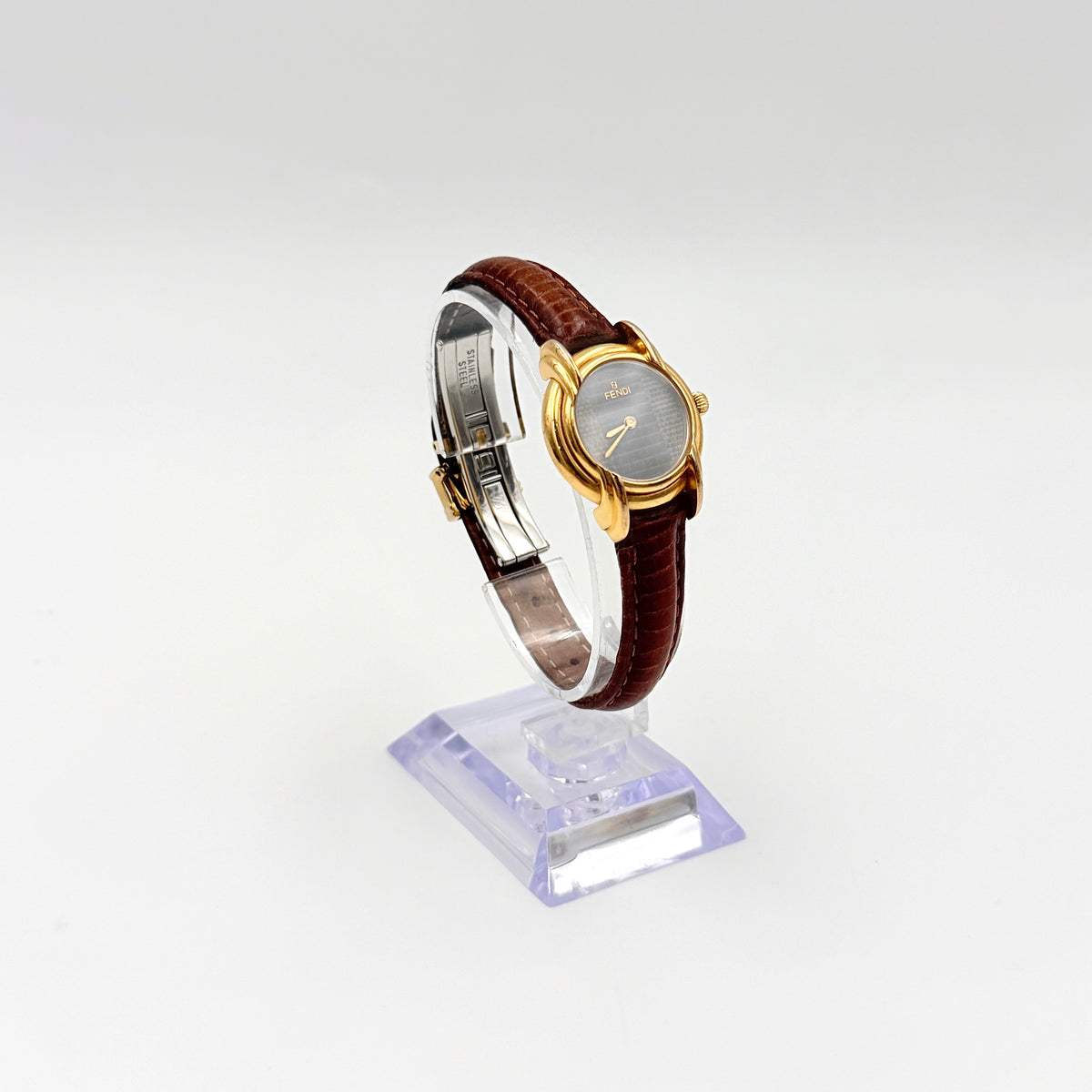 Fendi 350L Orologi Quartz Watch in gold with brown leather strap, displayed with original box and booklet.