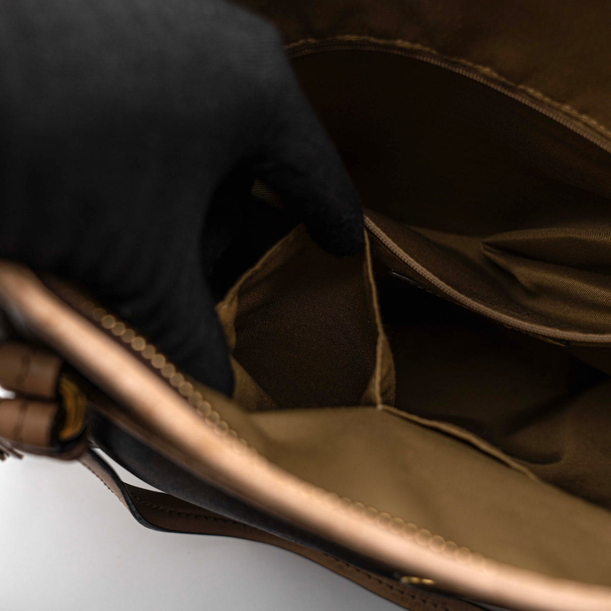 Coach Signature Peyton Pocket tote bag in brown canvas with tan leather trim, shown with both handles and detachable strap.