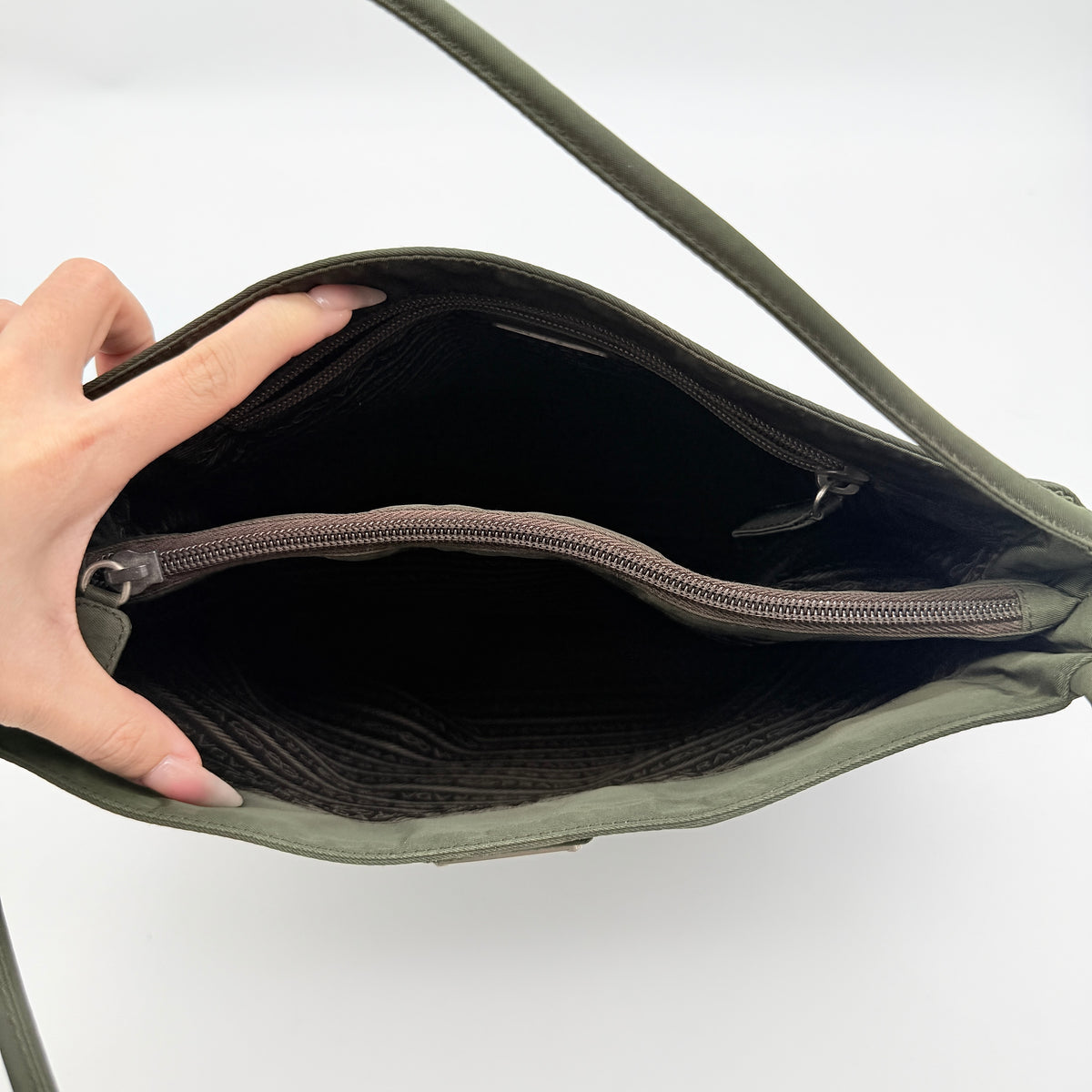 Prada Tessuto Nylon City Tote Bag in dark green nylon with double handles and signature triangle logo plaque on the front.