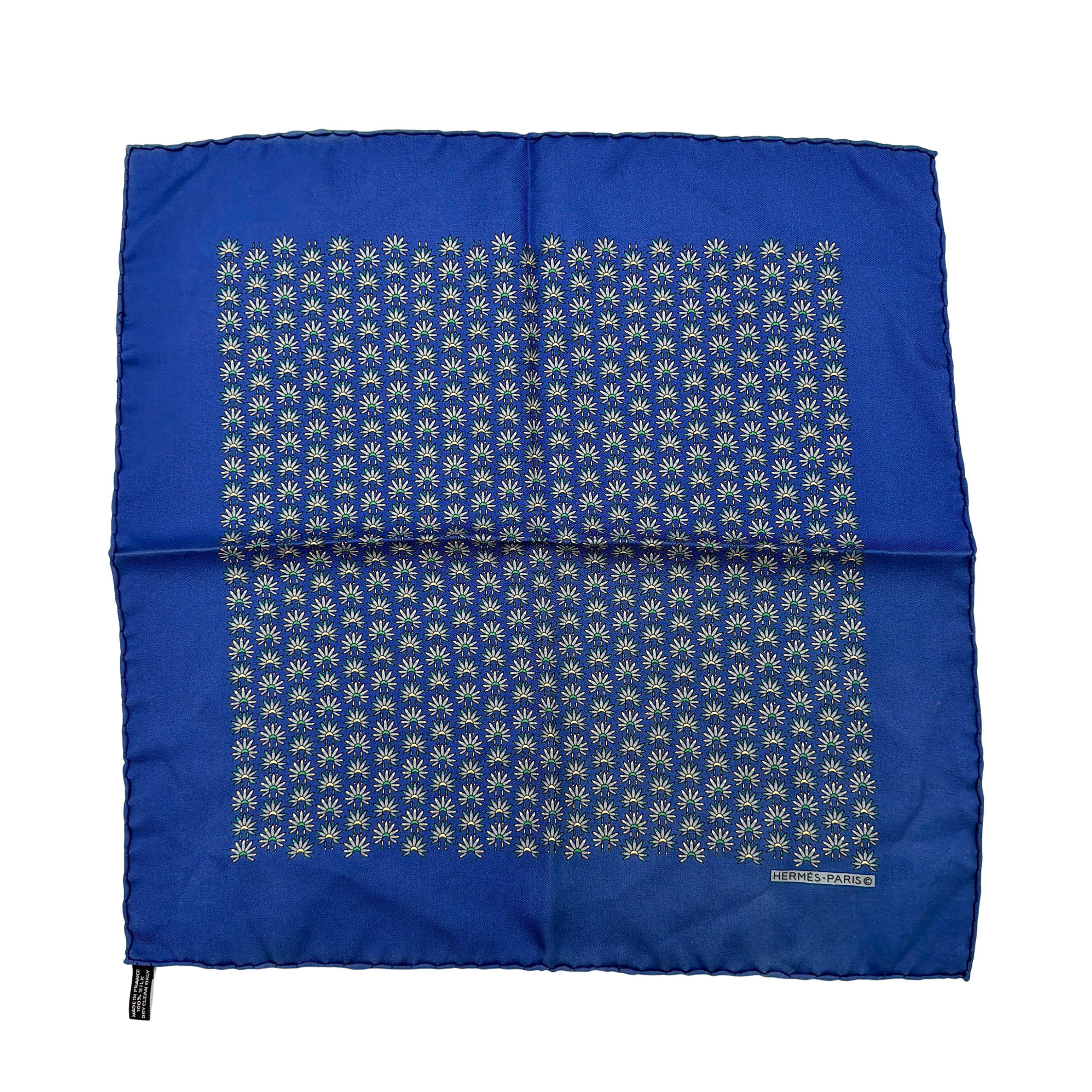 Hermès silk scarf in vibrant blue, featuring a precise all-over floral pattern and hand-rolled edges.