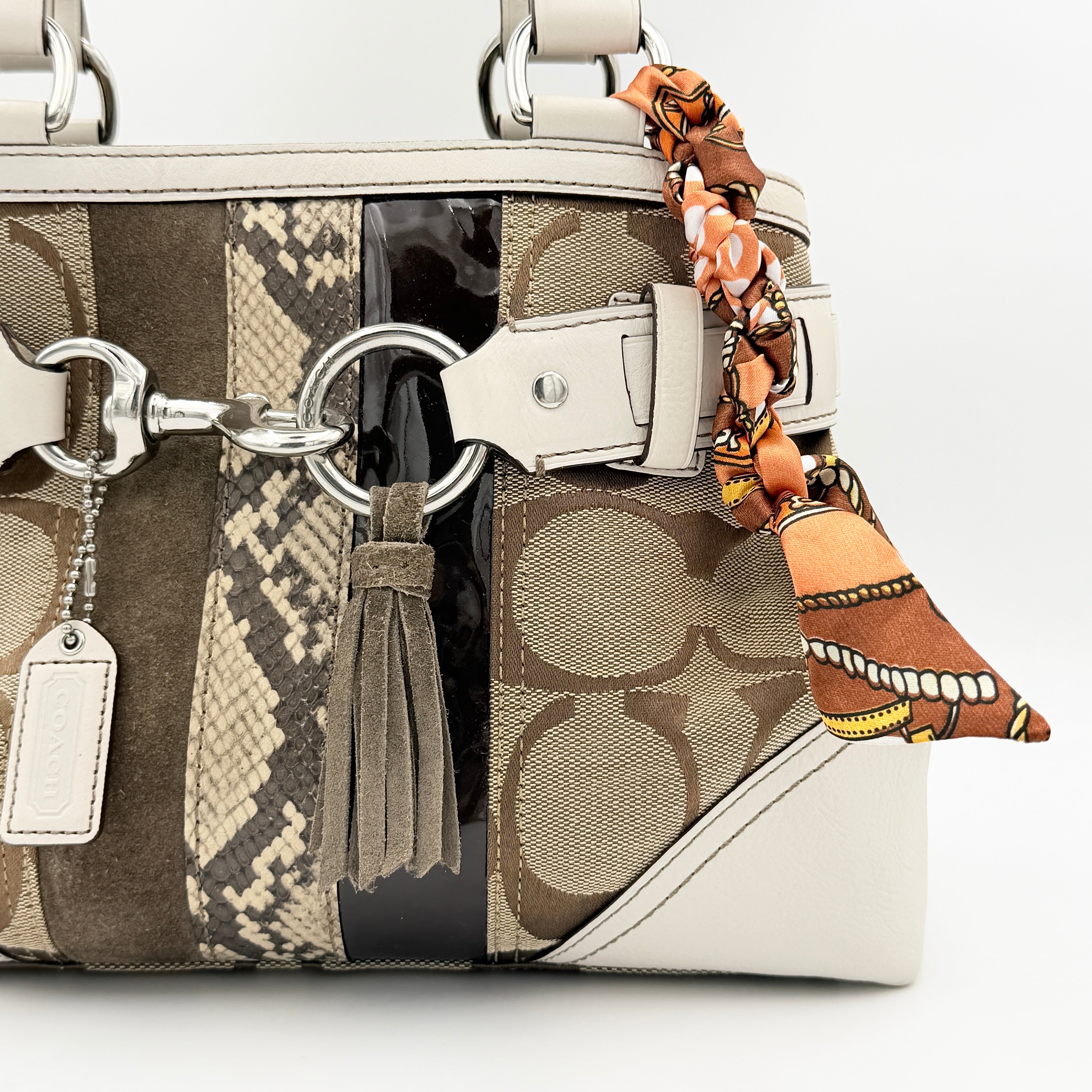 Coach Signature Hampton Python Stripe Handbag in multicolour leather and canvas with silver-tone hardware and an orange scarf detail.