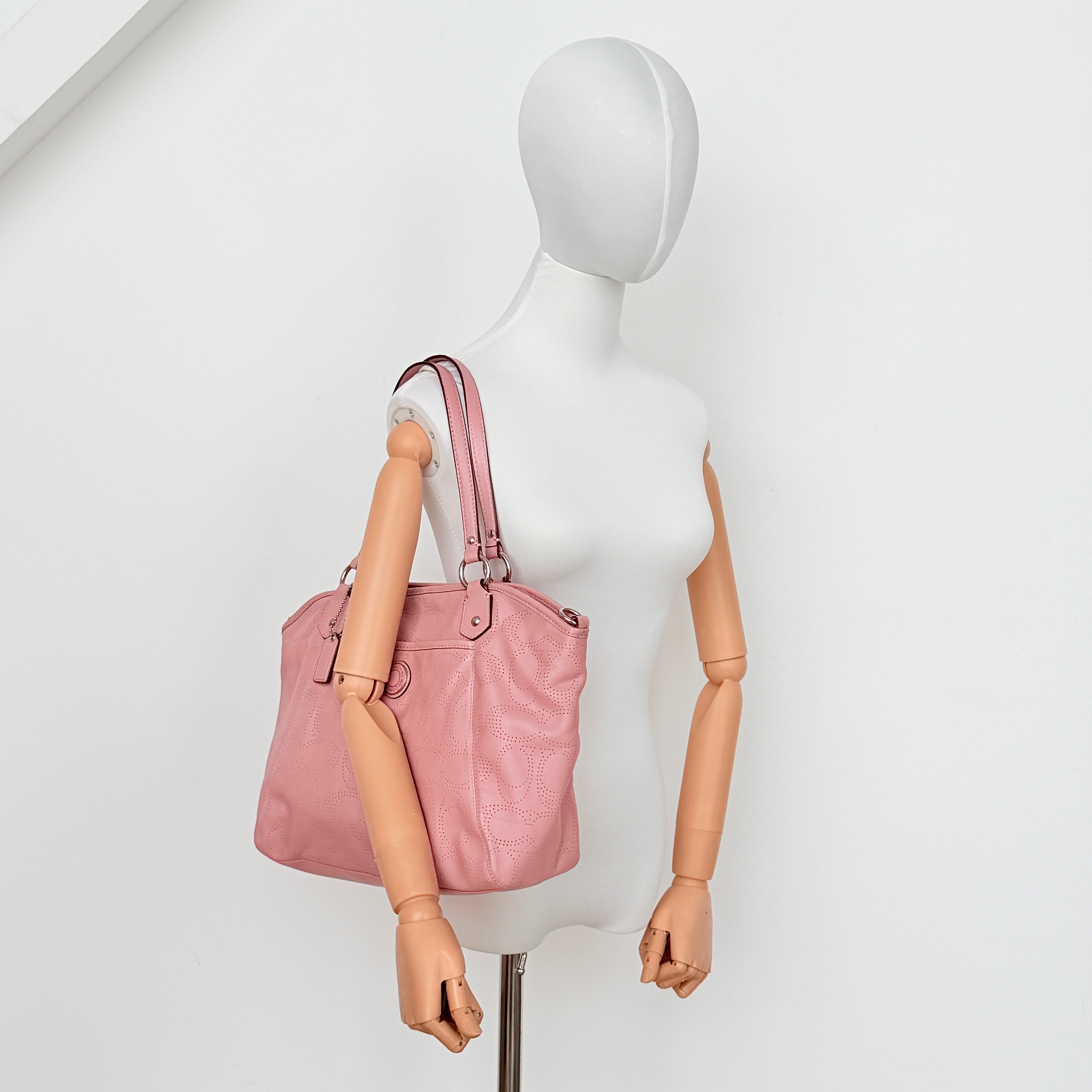 Coach 2Way Perforated Shoulder Bag in soft pink leather with silver hardware and detachable strap, displayed on a white background.