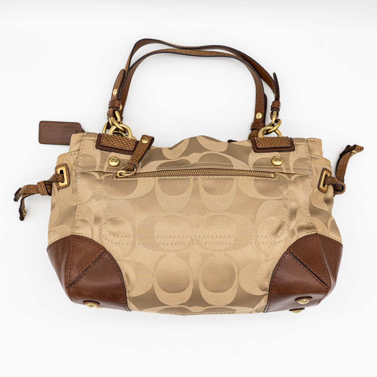 Coach Signature Peyton Shoulder Bag in brown sateen and leather with gold-tone hardware and turnlock pocket, photographed on a white background.