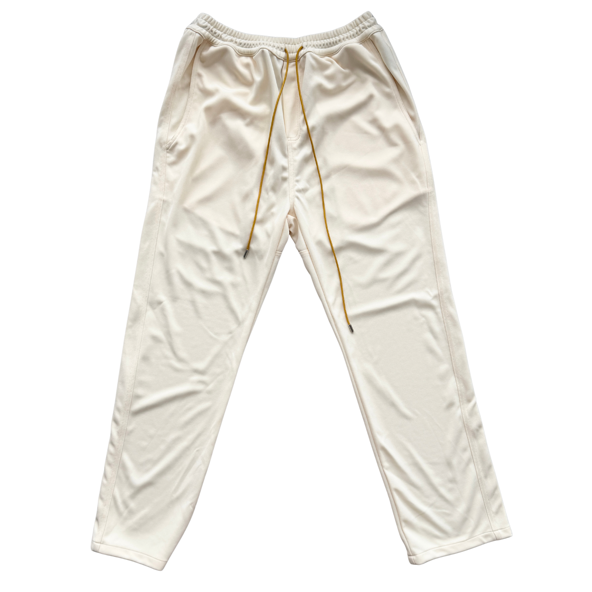 Rhude lounge track pants in cream with yellow drawstrings, displayed flat against a white background.