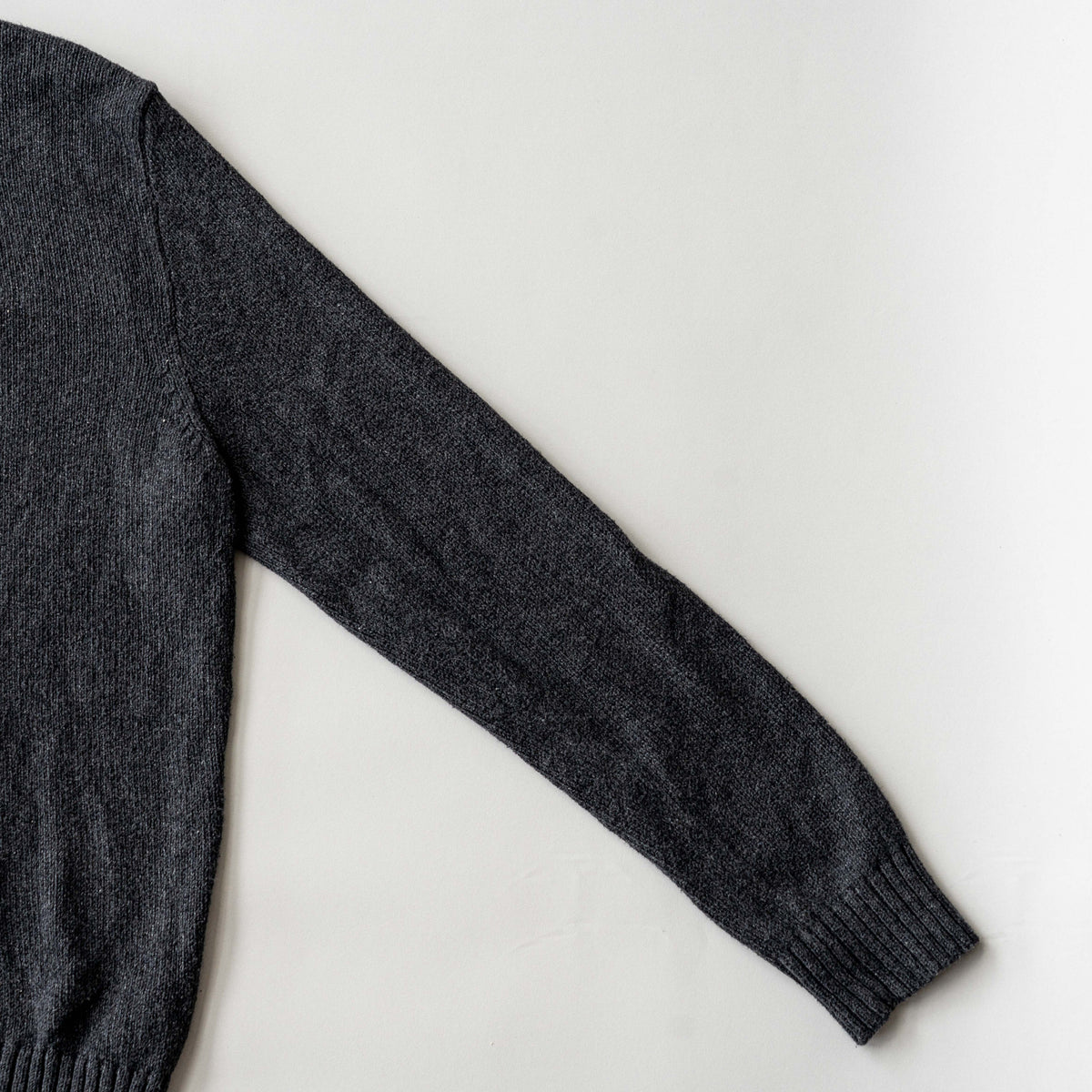 Dark grey Polo Ralph Lauren quarter zip mockneck pullover sweater with ribbed collar and green pony logo.