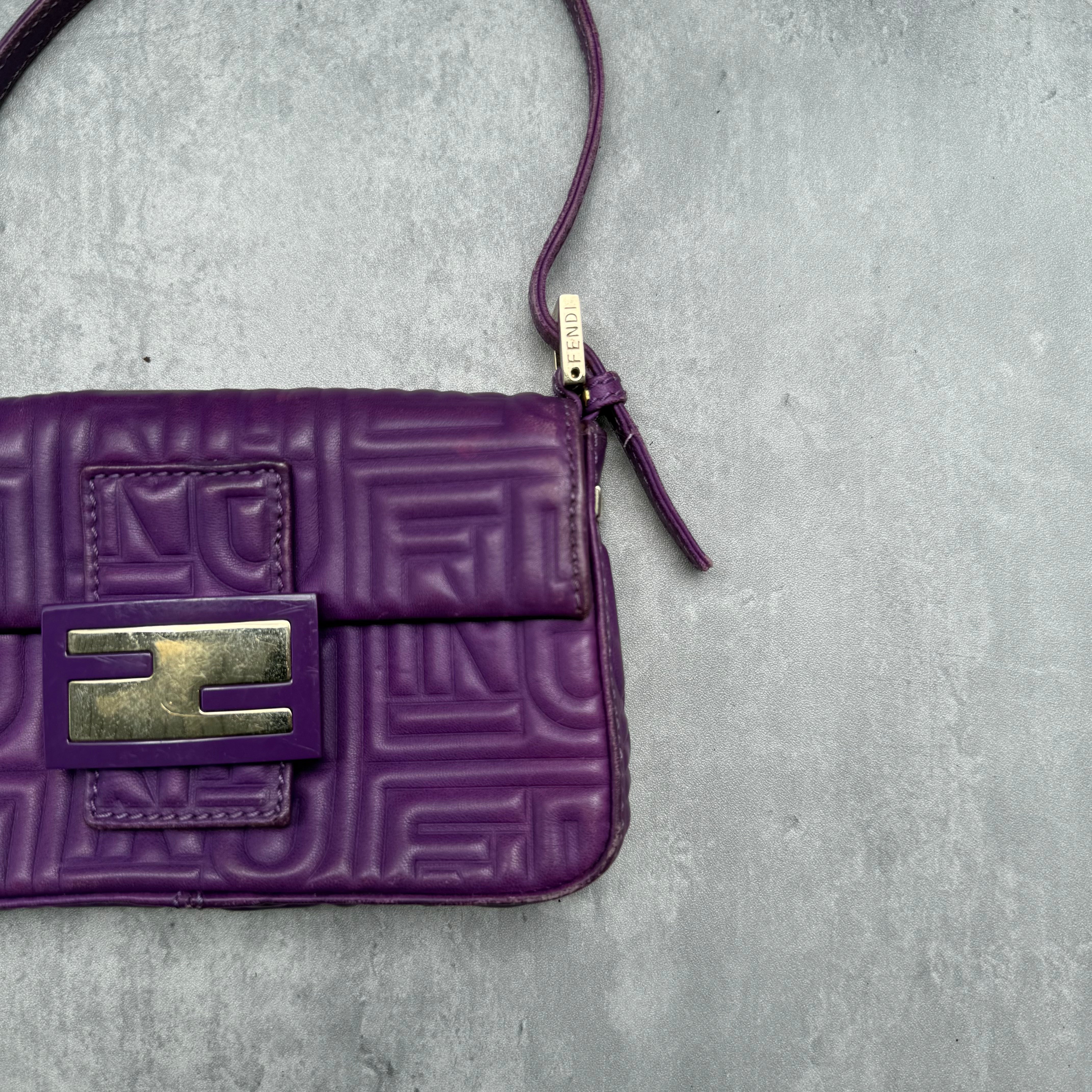 Fendi Baguette Shoulder Bag in purple embossed leather with silver FF buckle and multicolor interior lining.