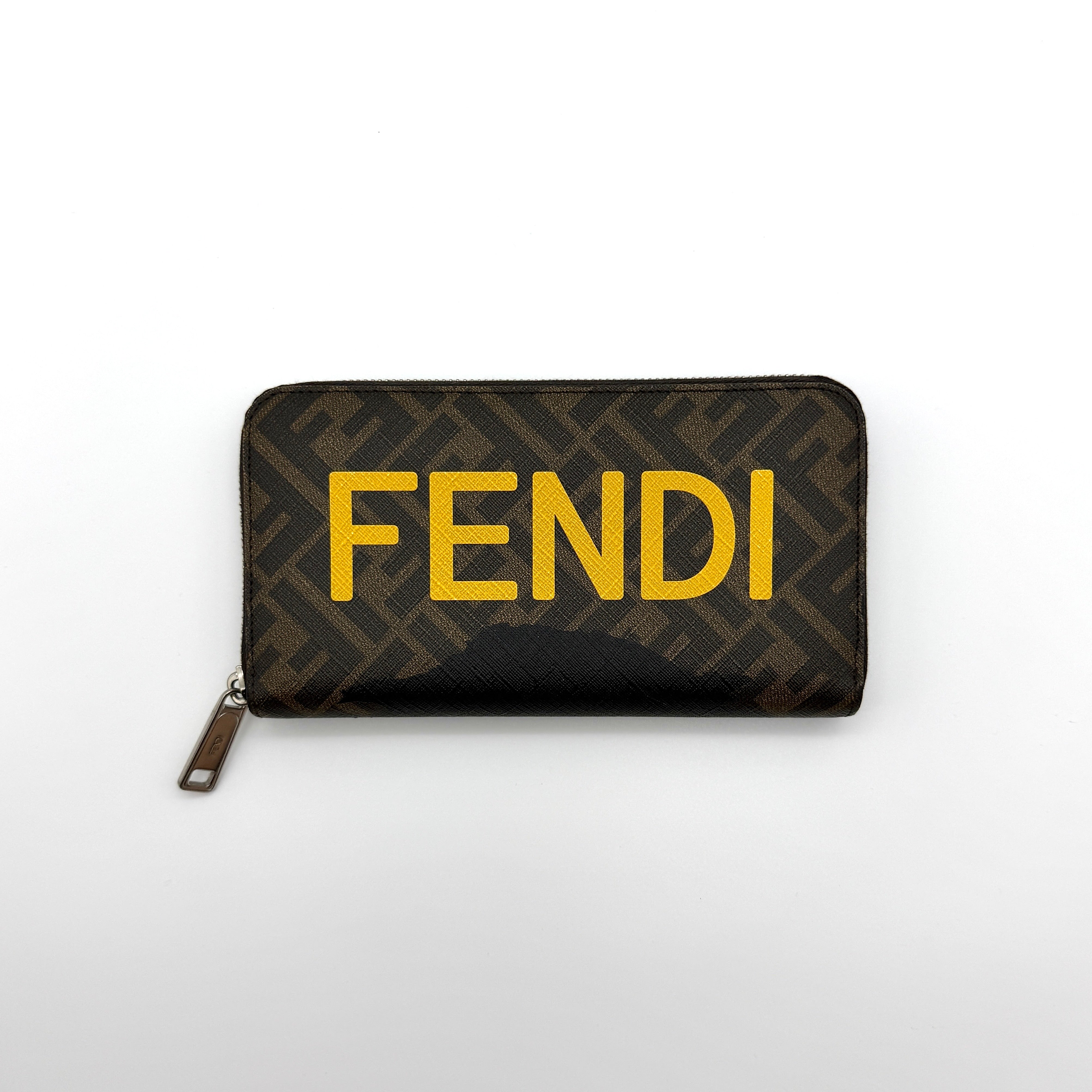 Fendi FF Zucca Logo Long Wallet in brown coated canvas with yellow FENDI logo and silver-tone zipper, featuring yellow leather interior — pre-loved.