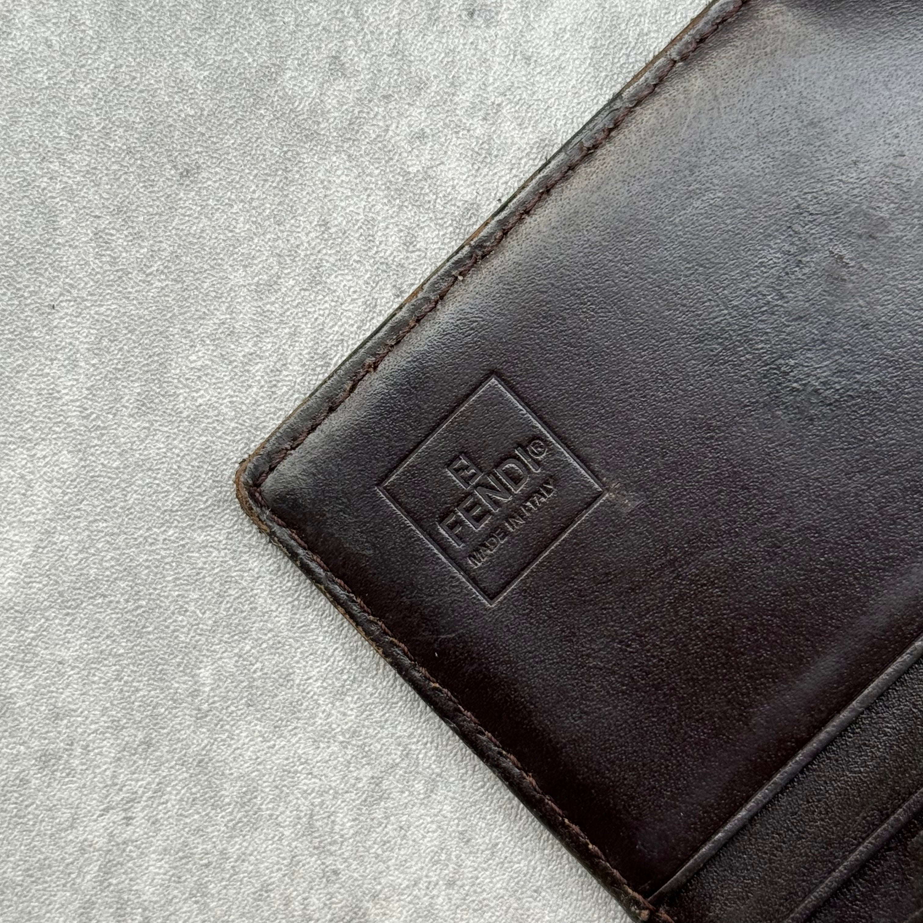 Fendi Zucca Canvas Long Wallet with brown leather interior, featuring FF monogram and snap closure