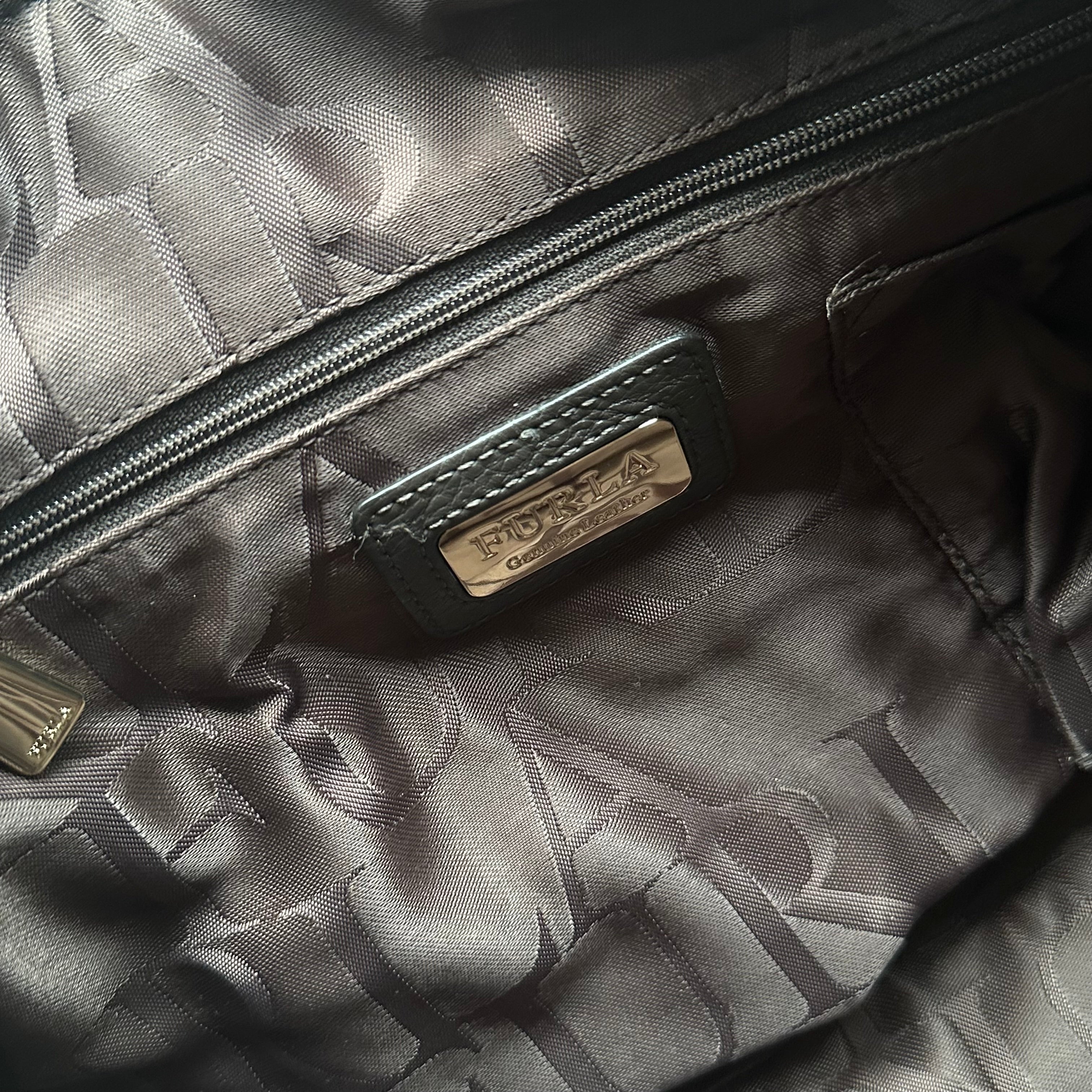 Furla Cindy Hobo Bag in brown pebbled leather with purple trim, gold zip closure, and logo-printed interior lining