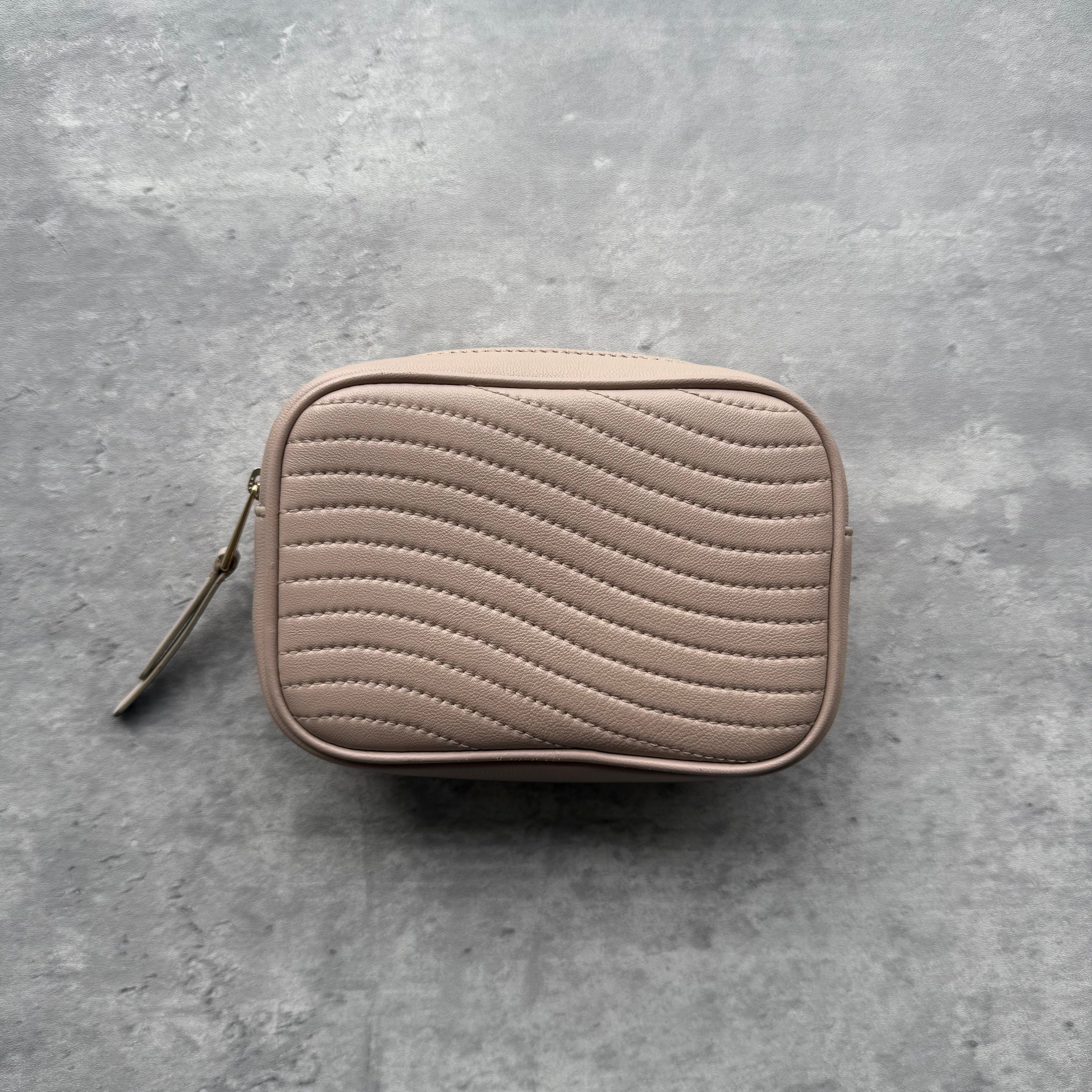 Furla Nude Leather Zip Pouch with quilted wave pattern, gold-tone hardware, zip closure, and lined interior.