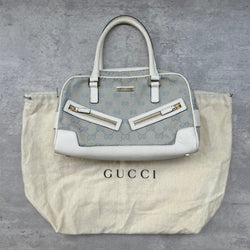 Gucci GG Canvas Boston Bowler Shoulder Bag in light blue with white leather trim, gold-tone hardware, and official Gucci dustbag